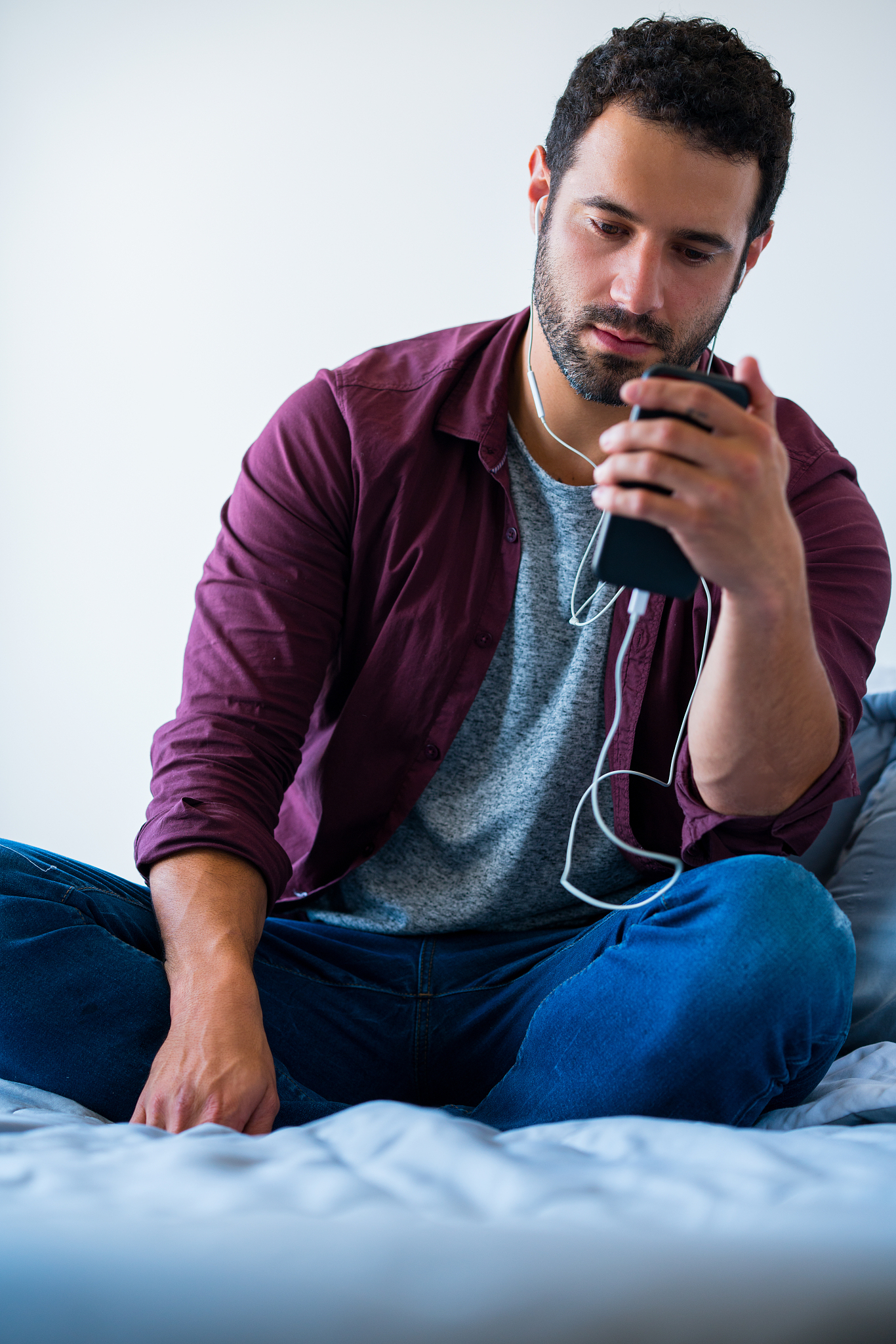 concentrated man listening to a podcast