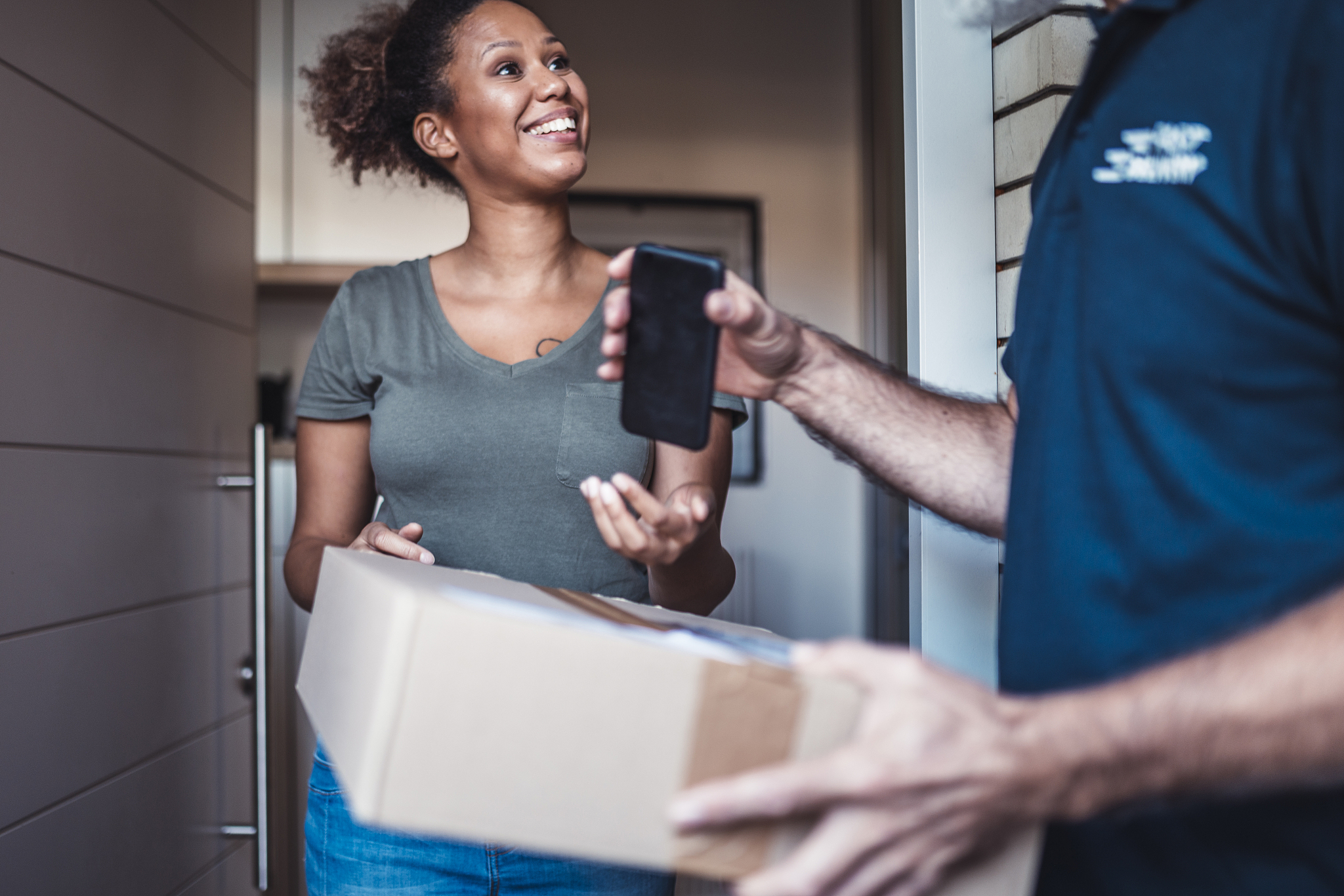 mature man delivery a package to a customer
