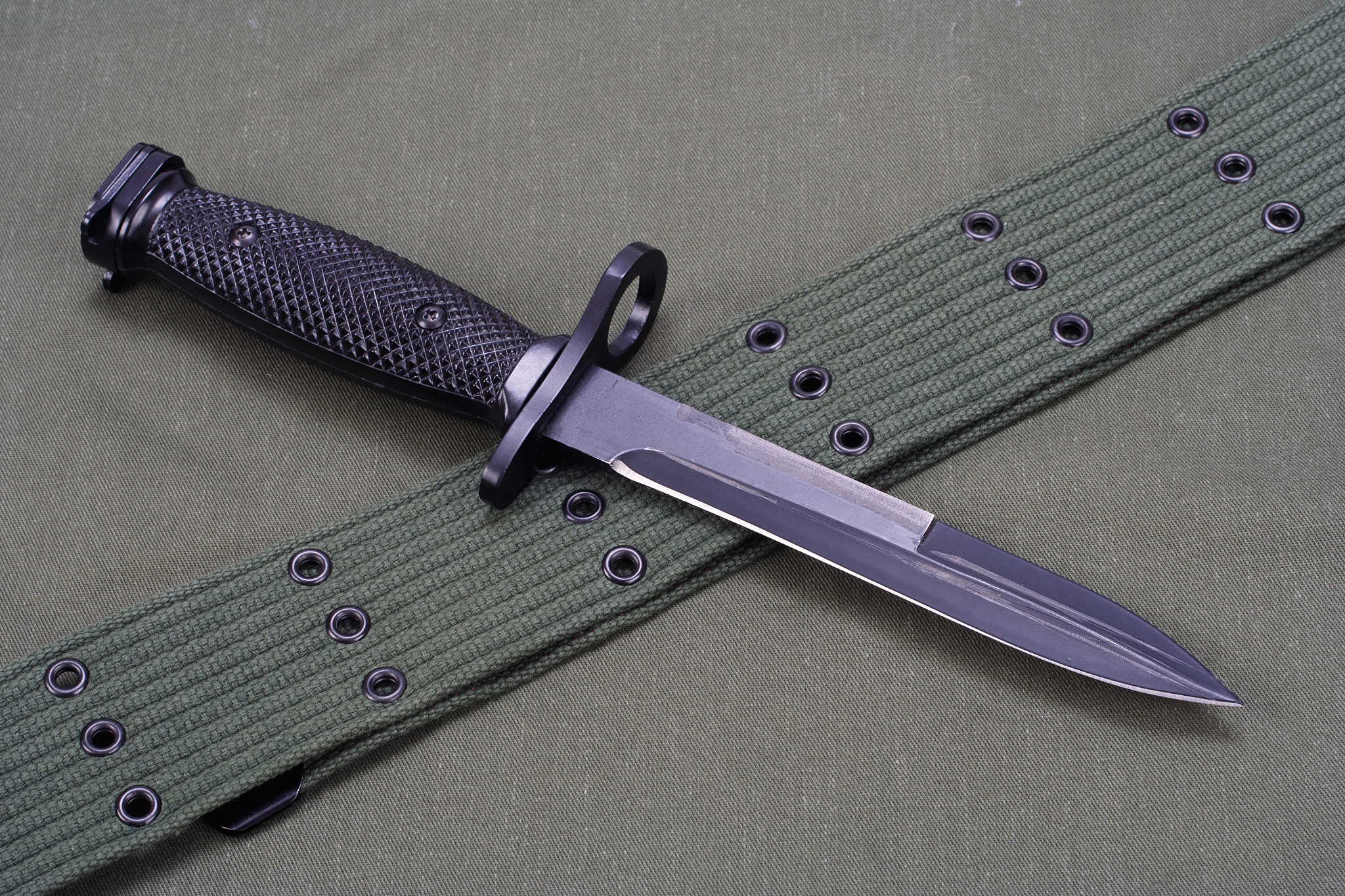 m16 rifle bayonet on uniform background