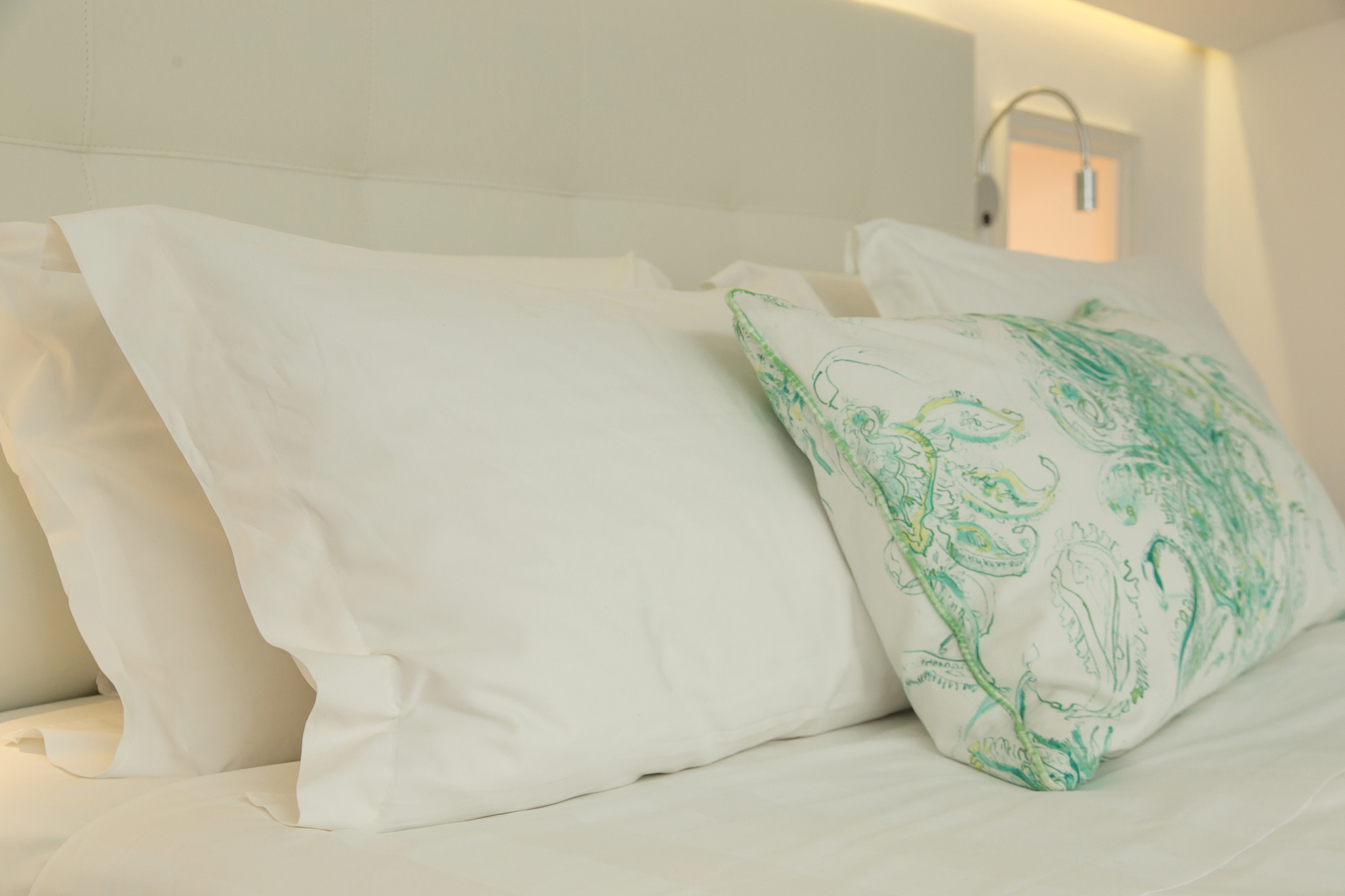 soft cushions on the king-sized bed in the room