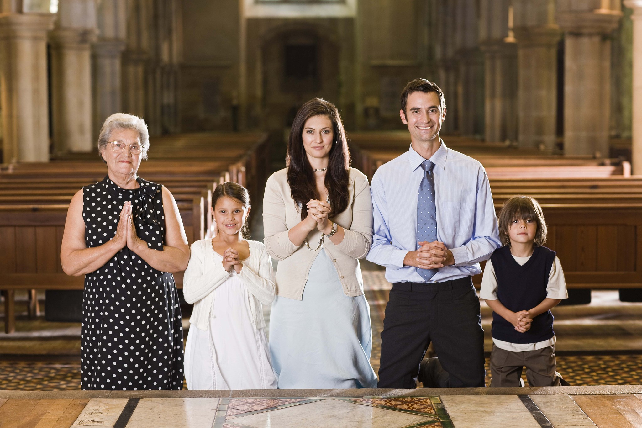 family praying in church