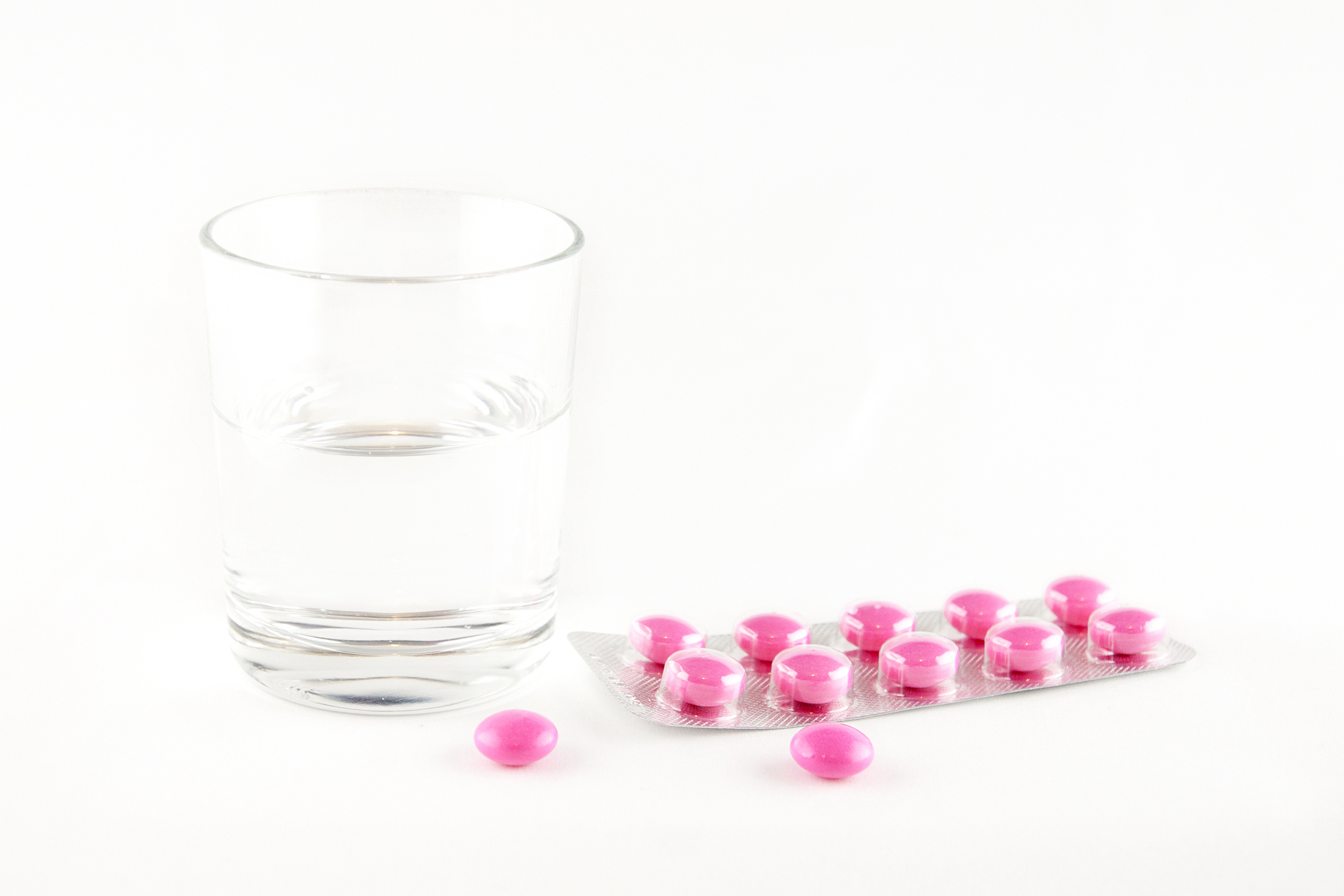 drugs and glass of water
