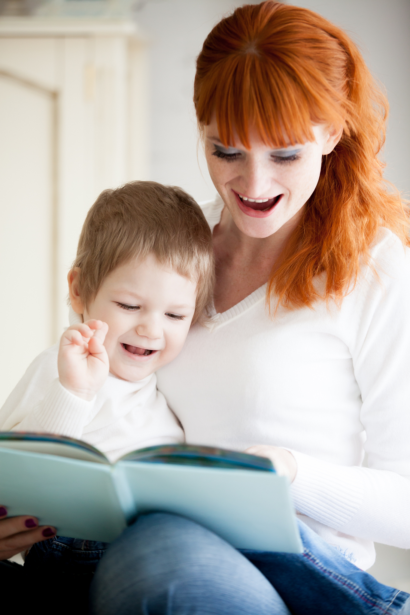 mom reading her son book
