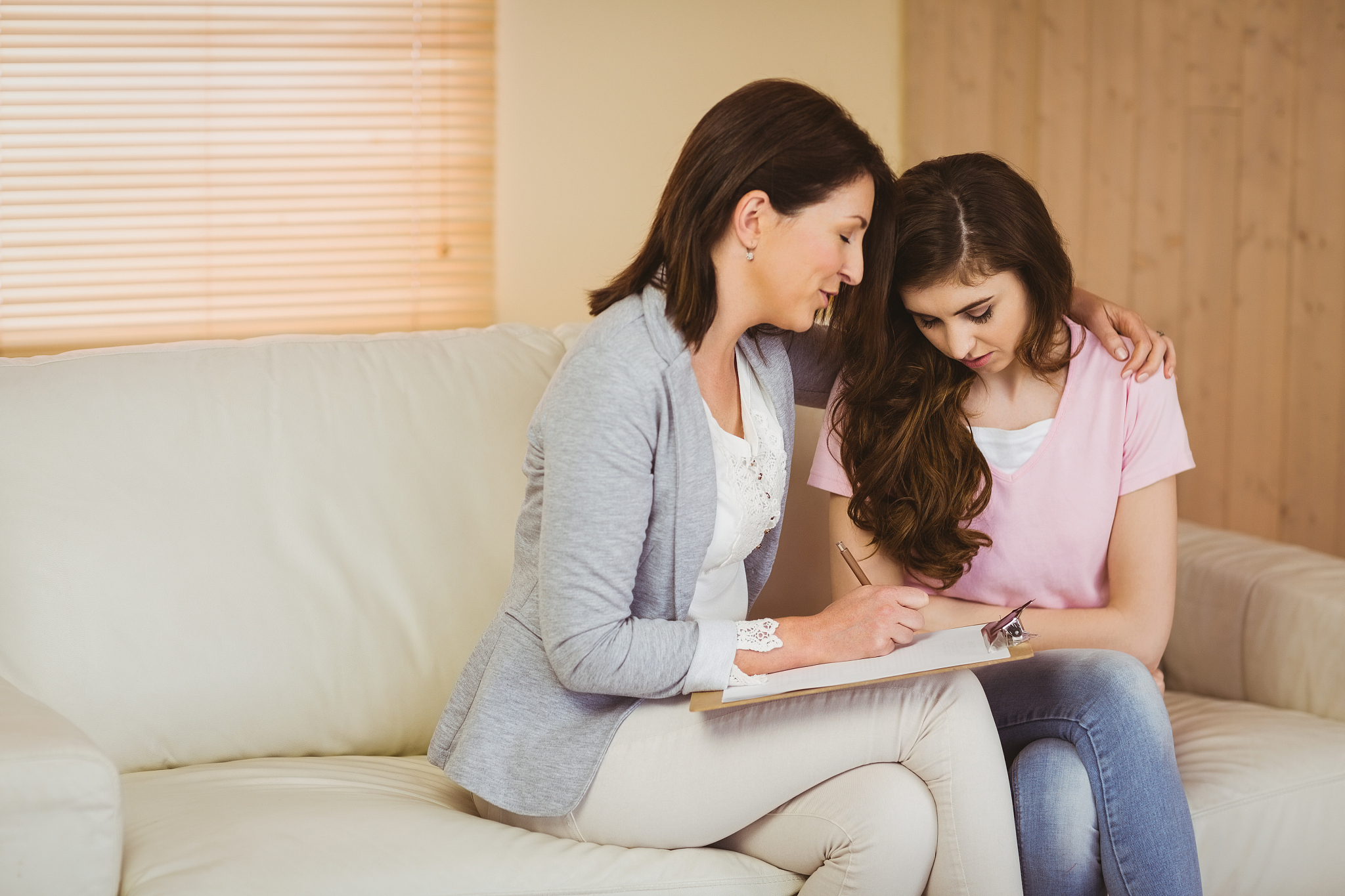 therapist listening to her upset patient