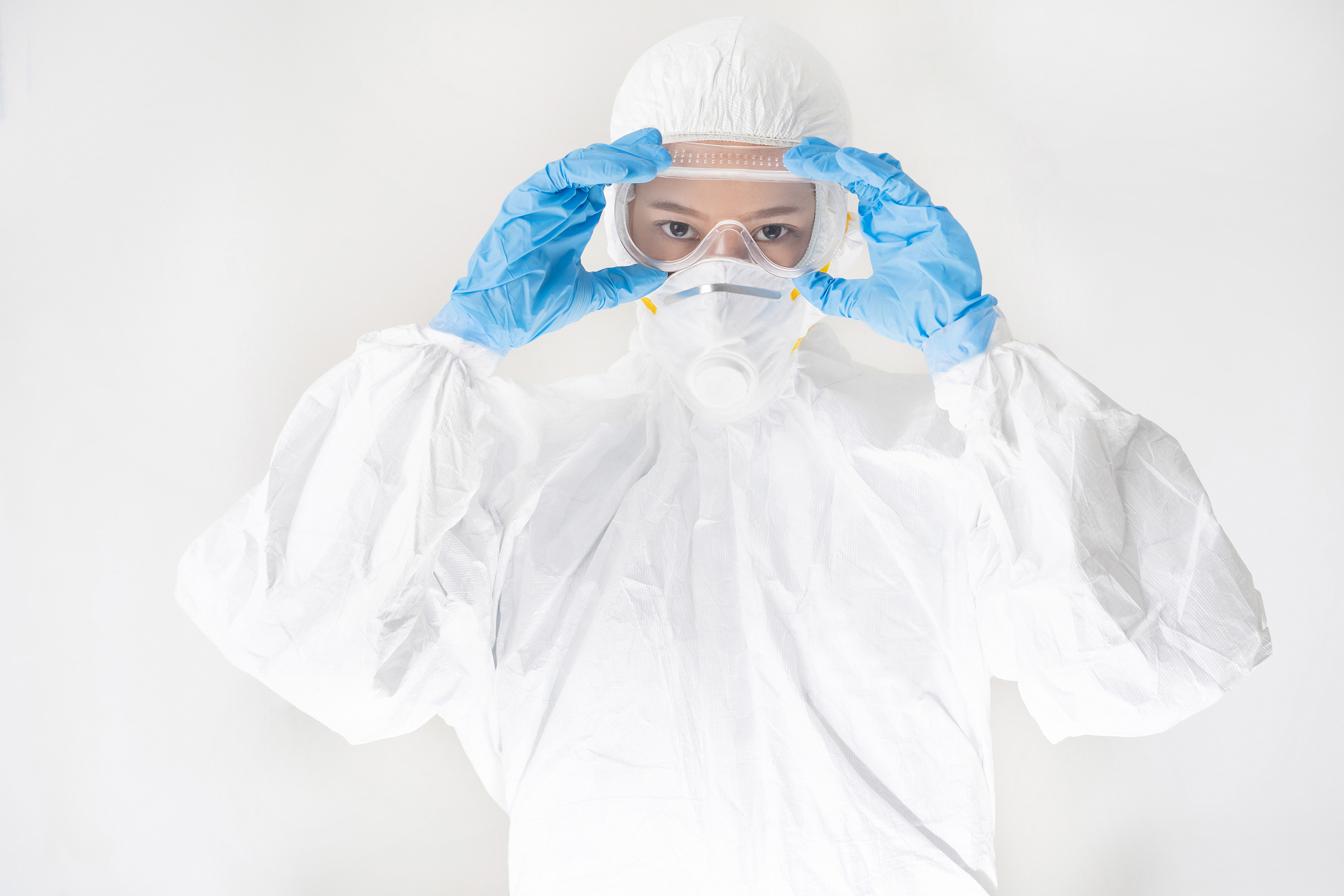female virologist, she wears ppe.