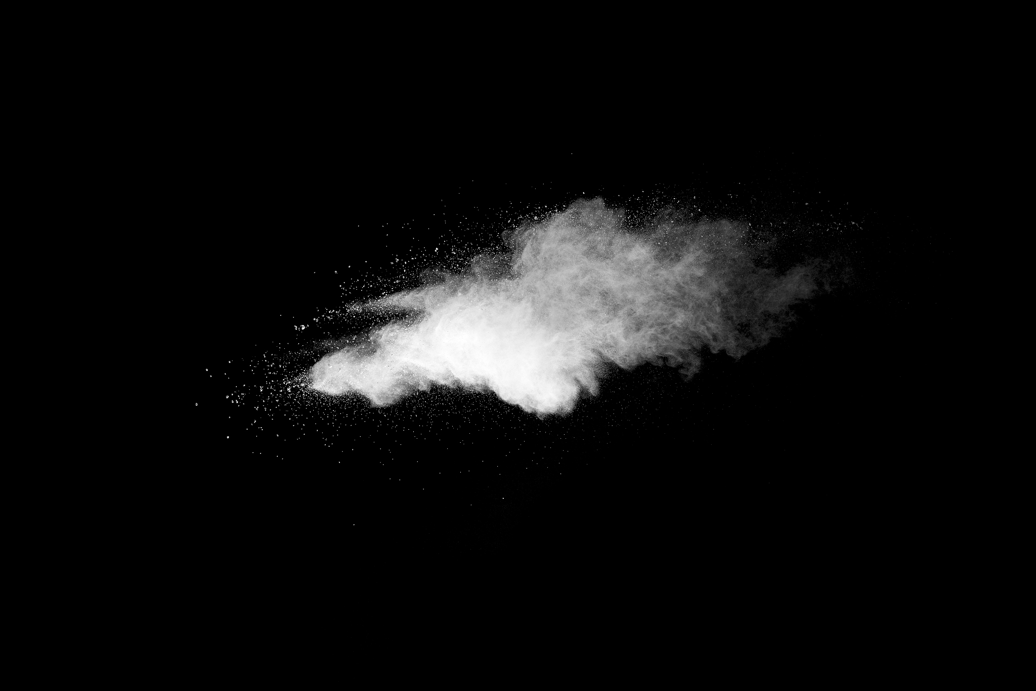 explosion of white dust on black background.