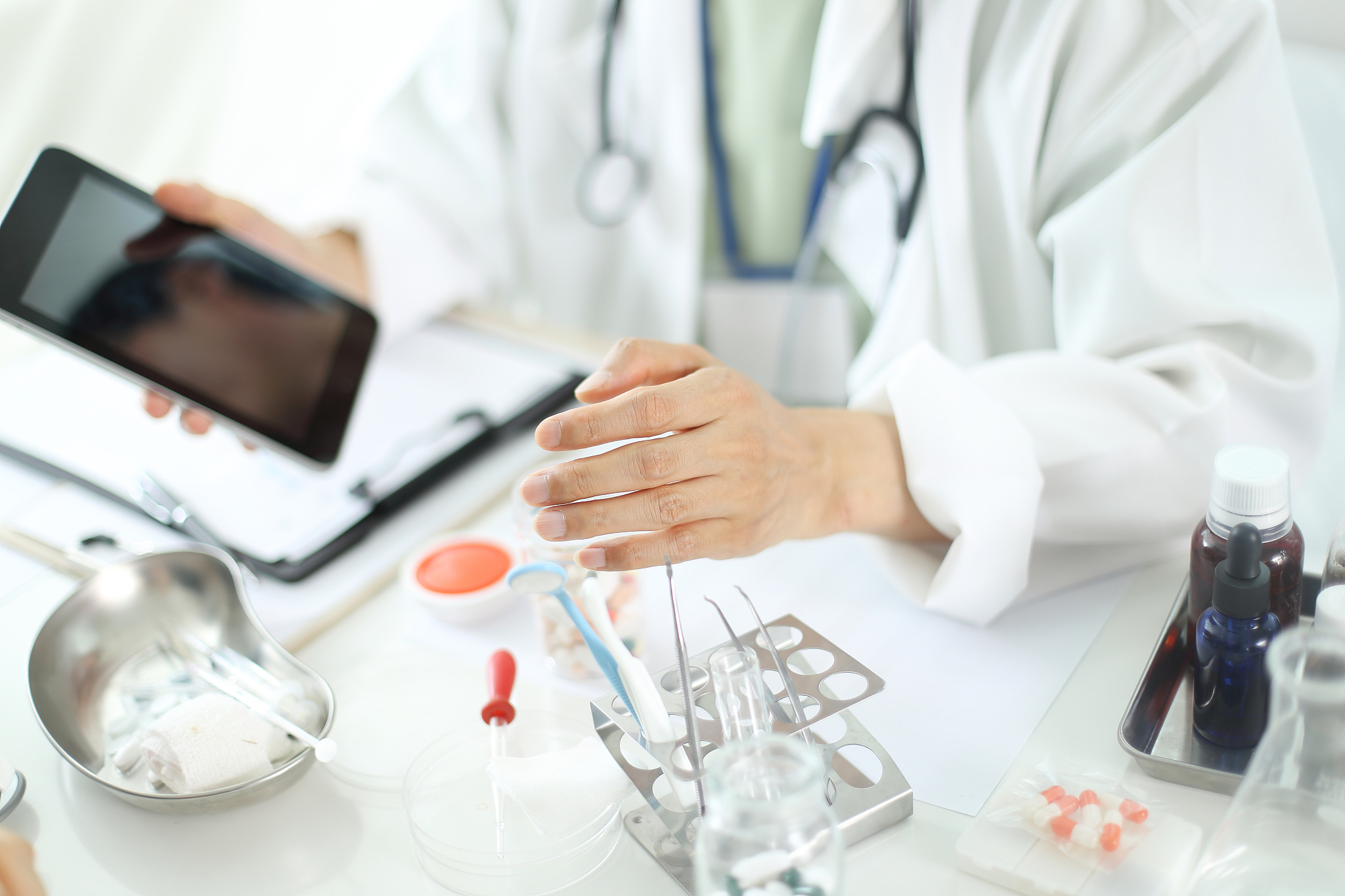 doctor giving consultation to patient with digital tablet