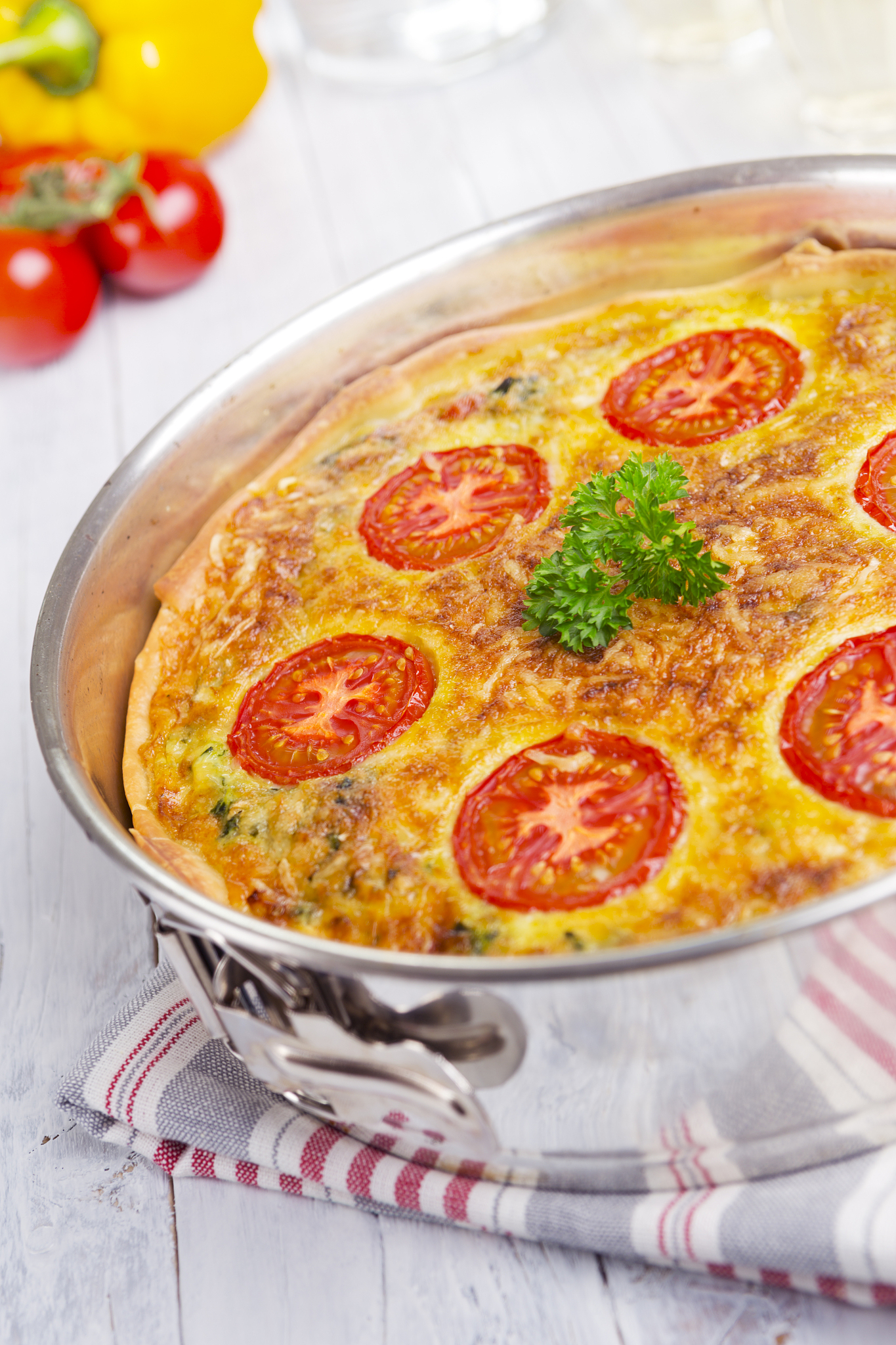 vegetable quiche on a bright, rustic table