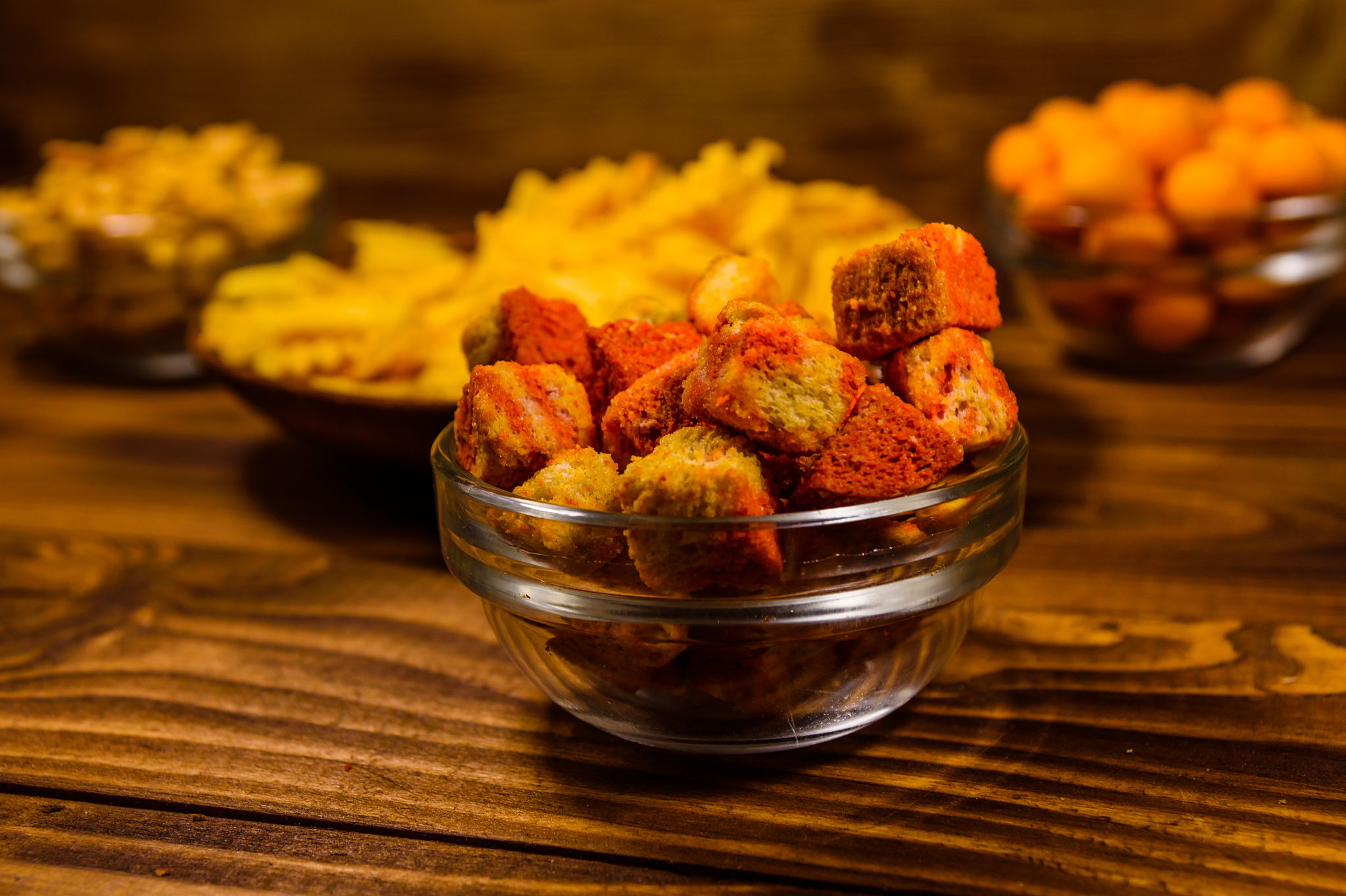 different snacks for beer on wooden table