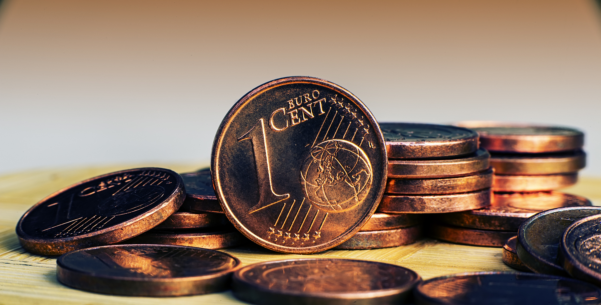 one eurocent coin on the background of coins.