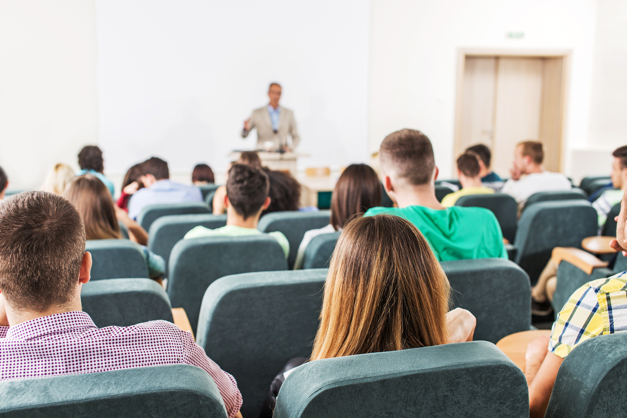rear view of group of students at the lecture hall.
