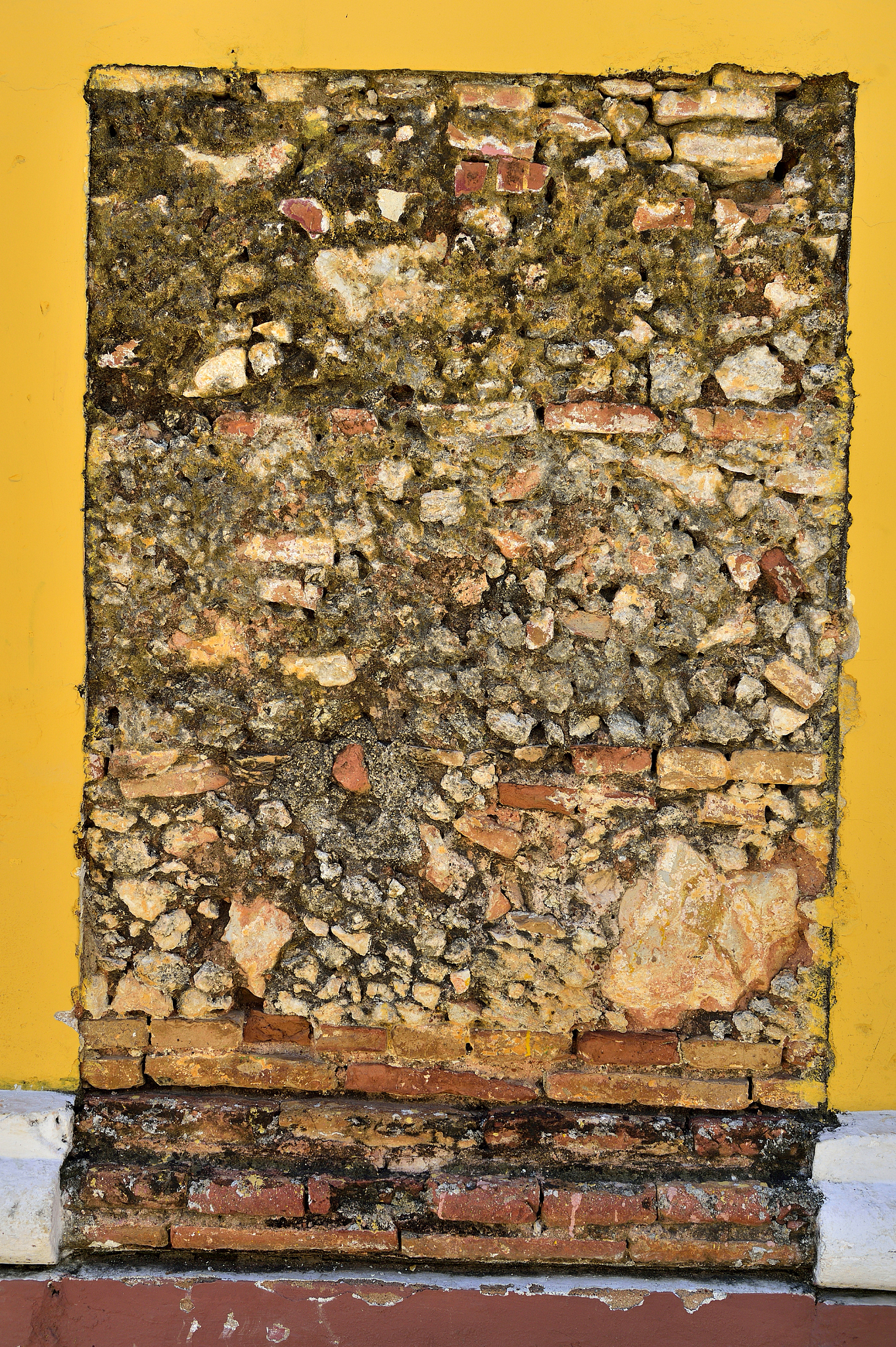 breaks on the yellow wall - antique brickwork