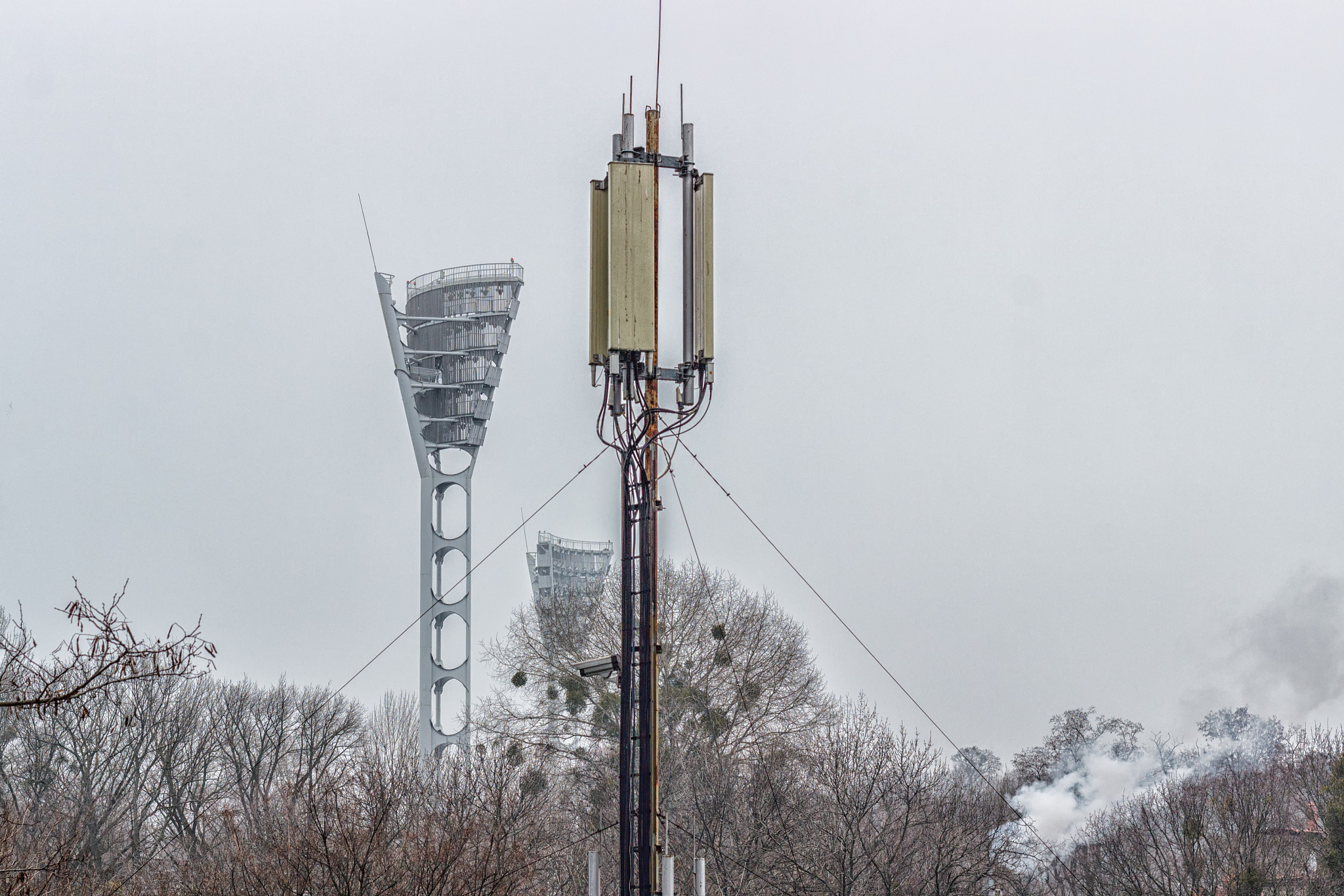 antenna for mobile communication on a tower against a blue sky.