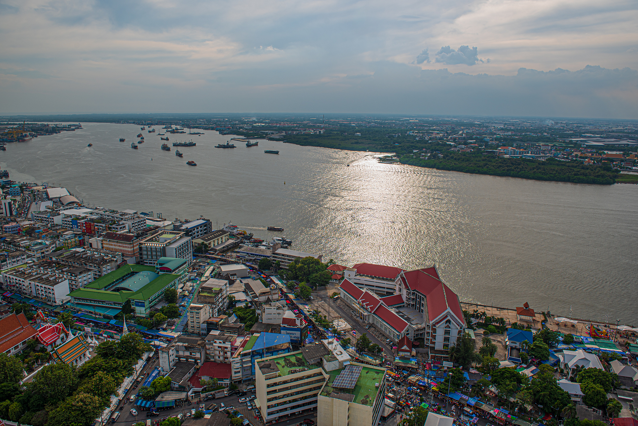 high angle view of townscape by sea against sky
