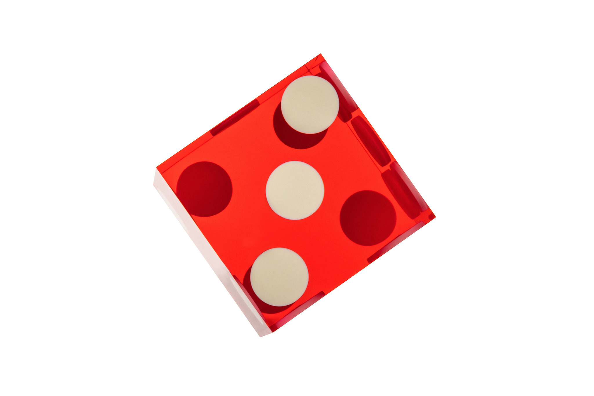 close-up of red glass classic poker dice. three, a top view with