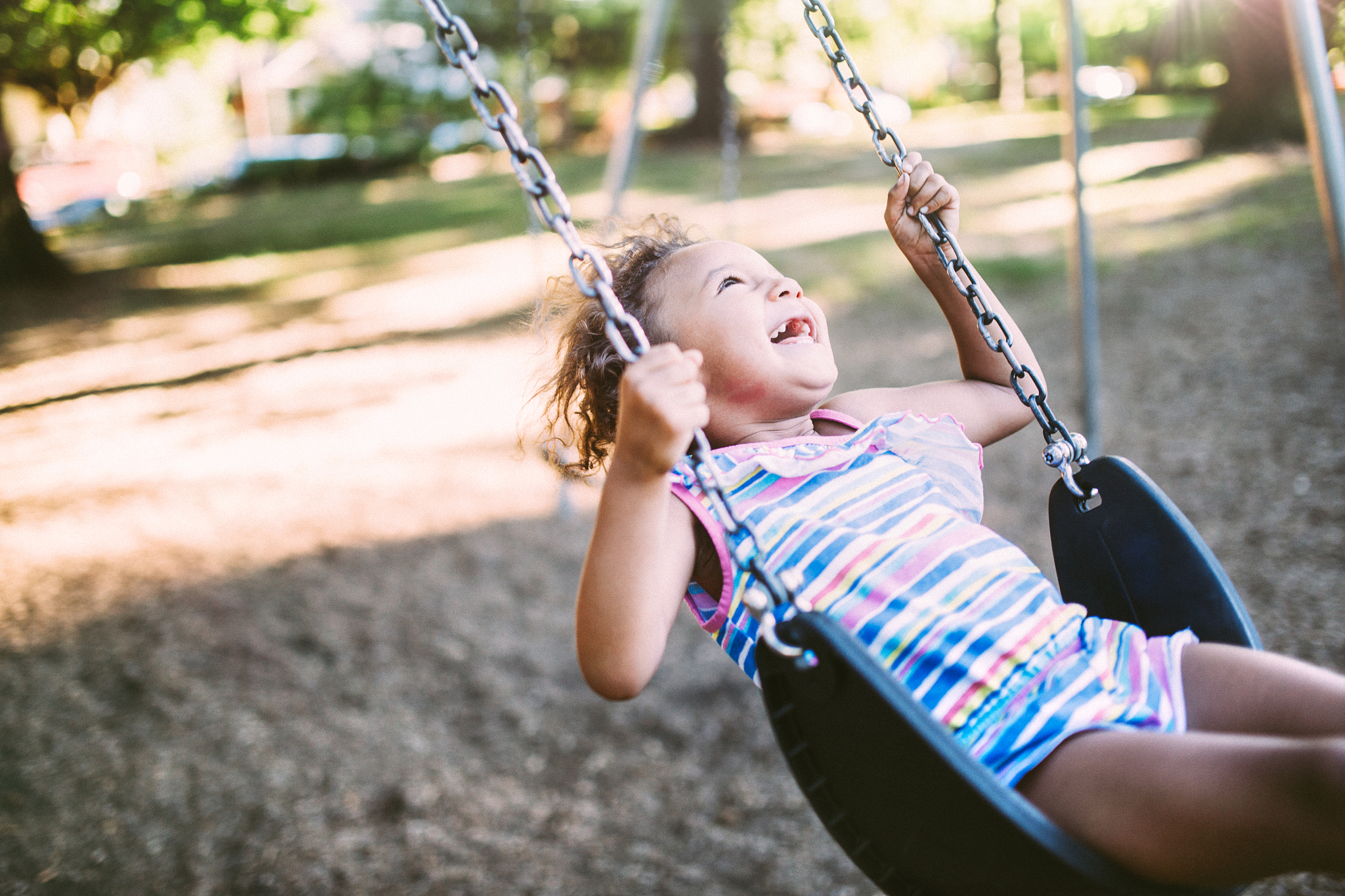 little girl on the swings