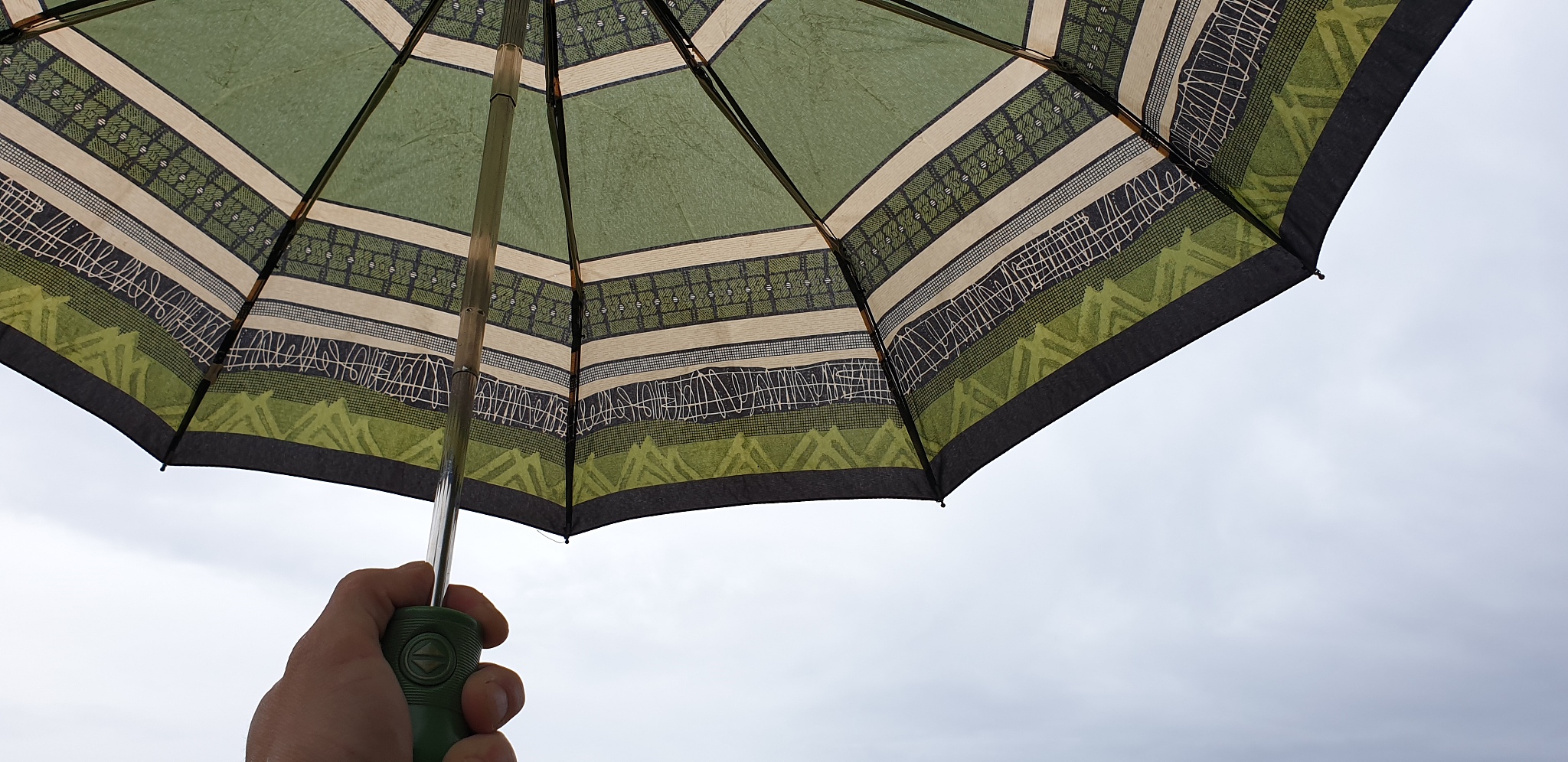rain and an umbrella. umbrella and clouds.