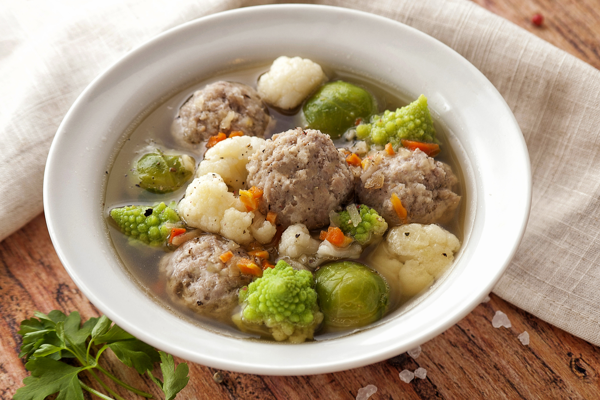 hot thick soup with meatballs and cabbage mix.