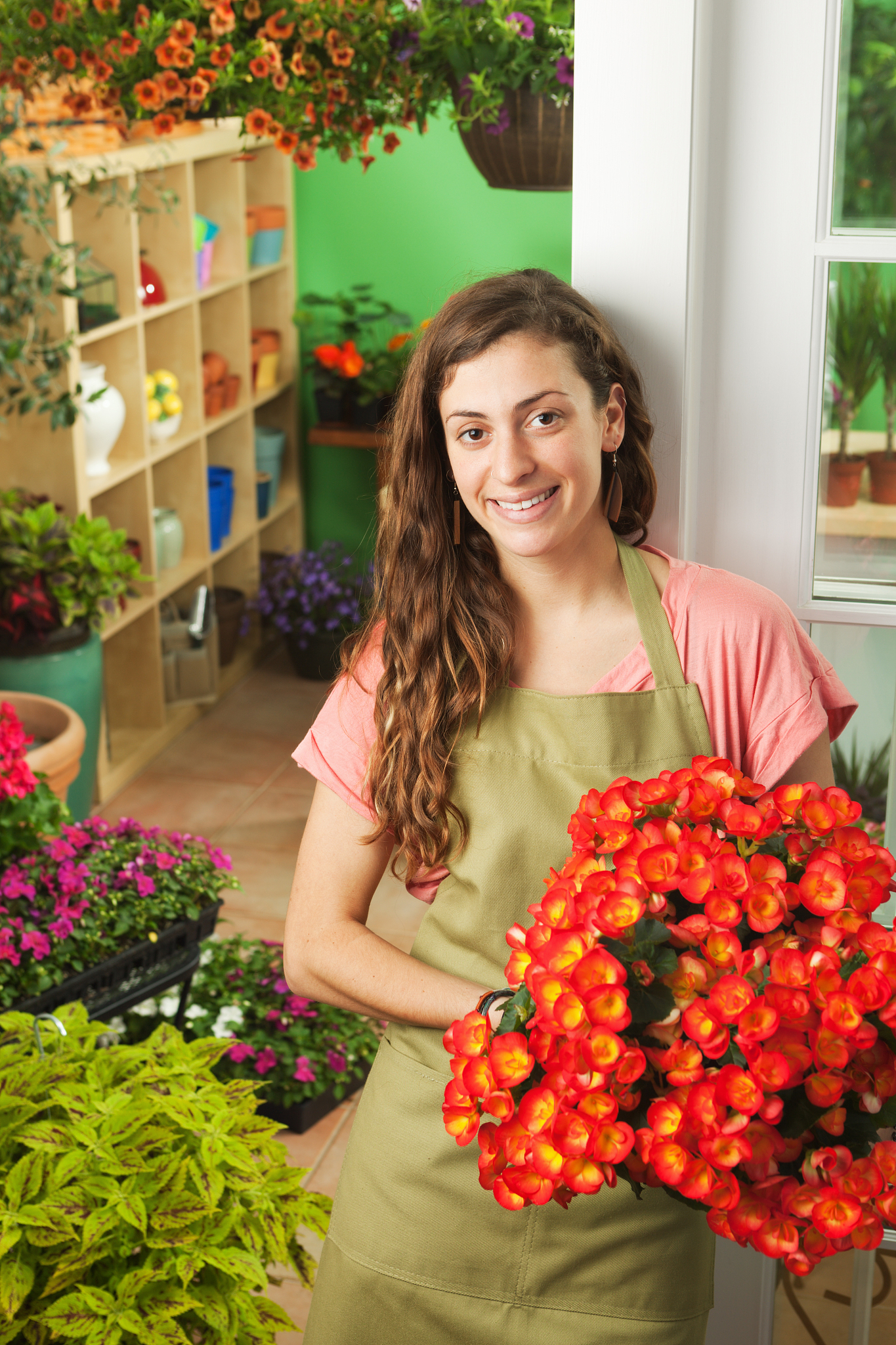 retail small business flower shop owner with her store