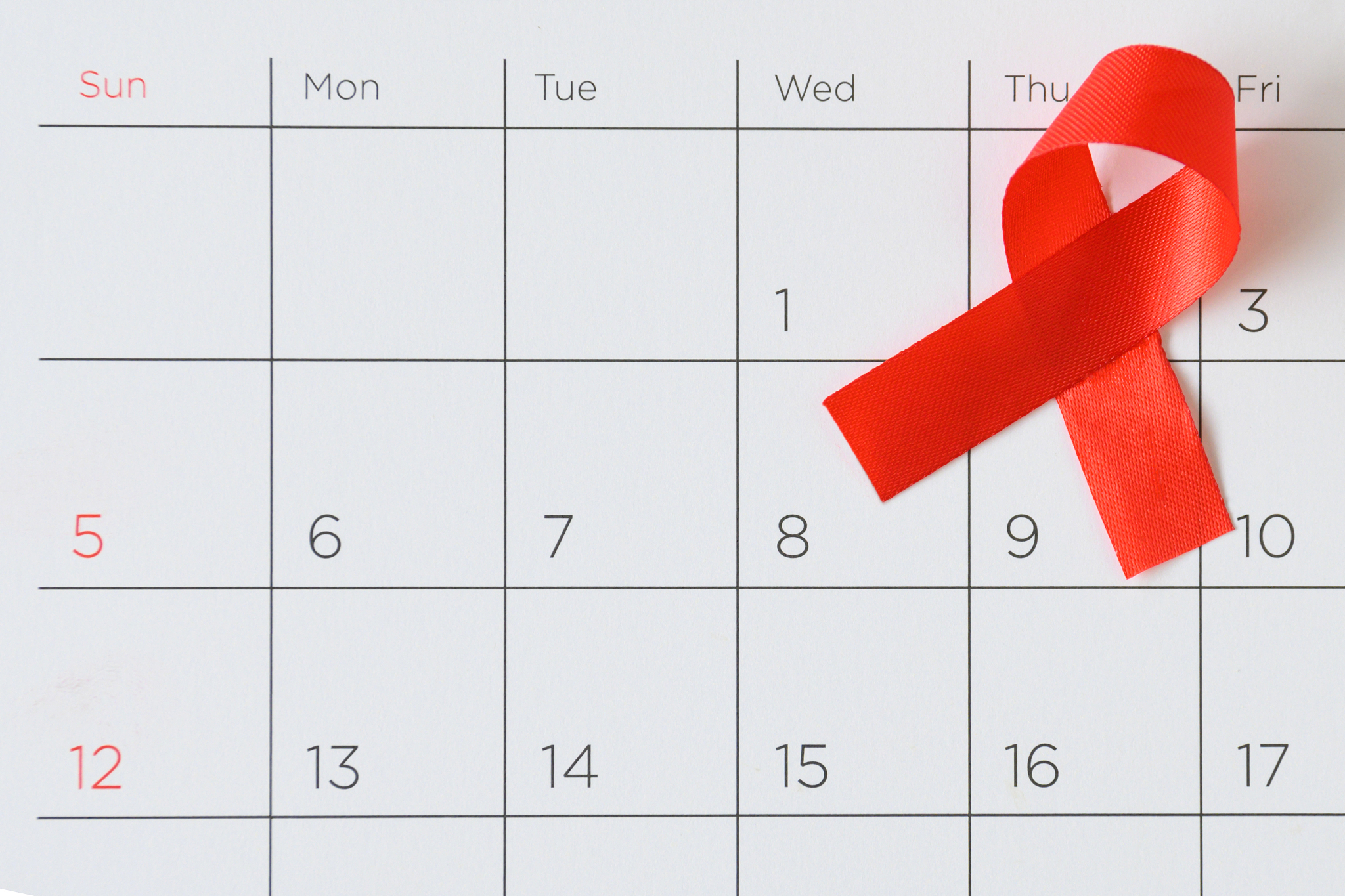 world aids day concept, red ribbon the date 1 december
