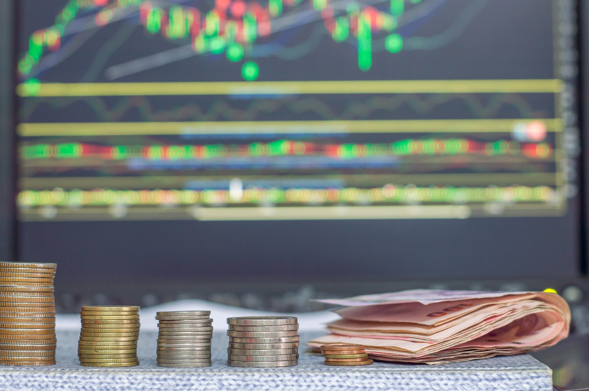 investment concept, coins, graph stock market background, thai m