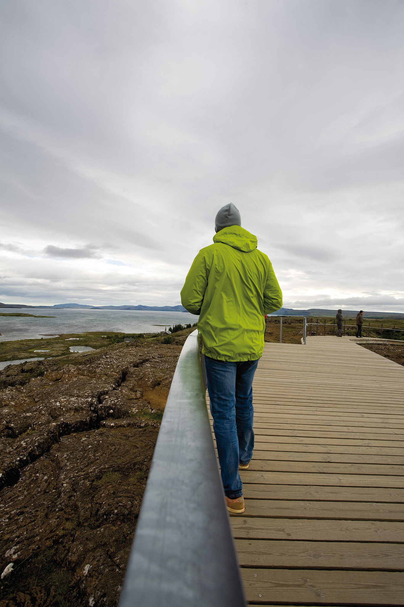 tourist walking in pingvellir (thingvellir) national park, icela