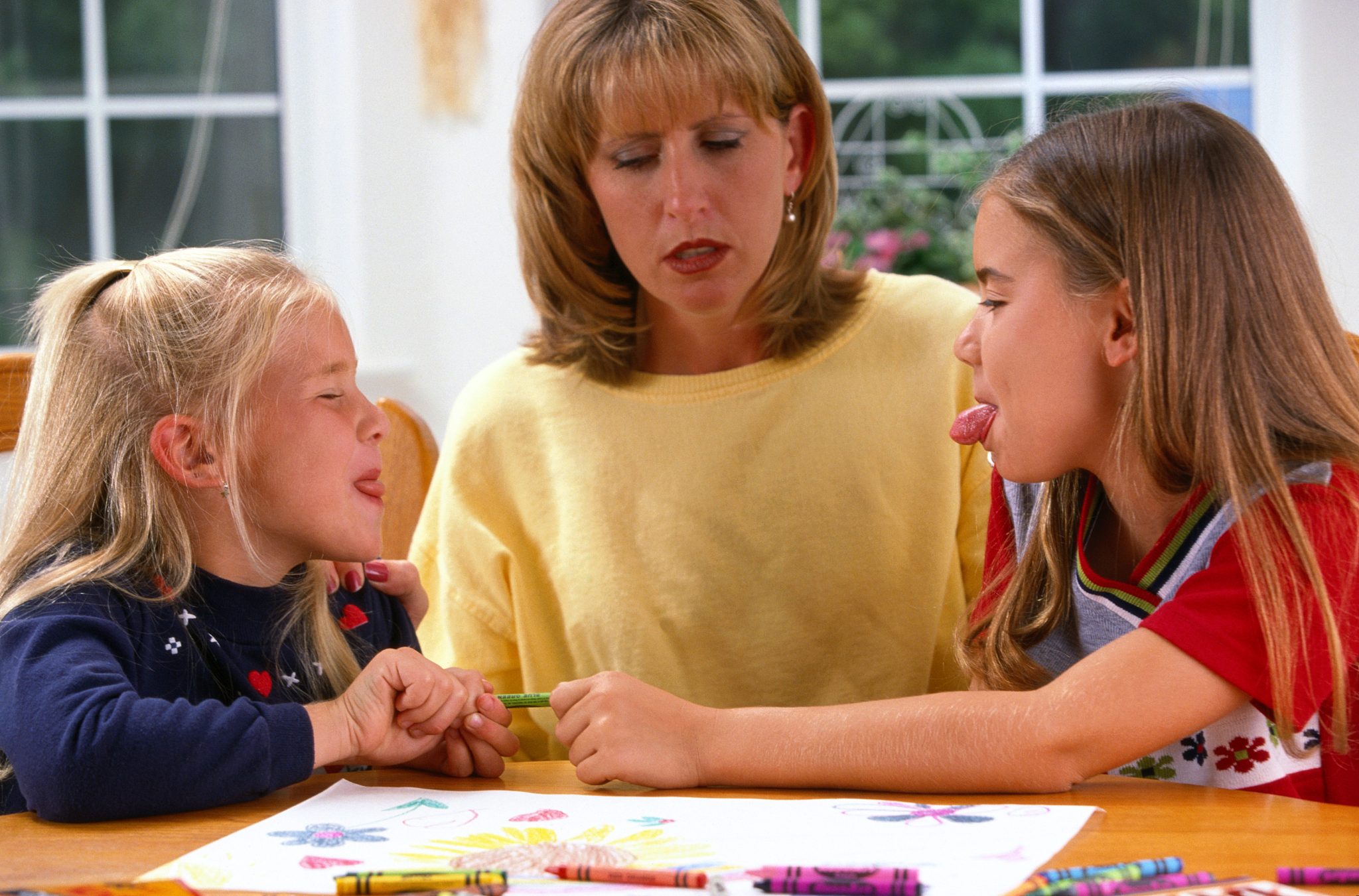 stressed mother with arguing daughters