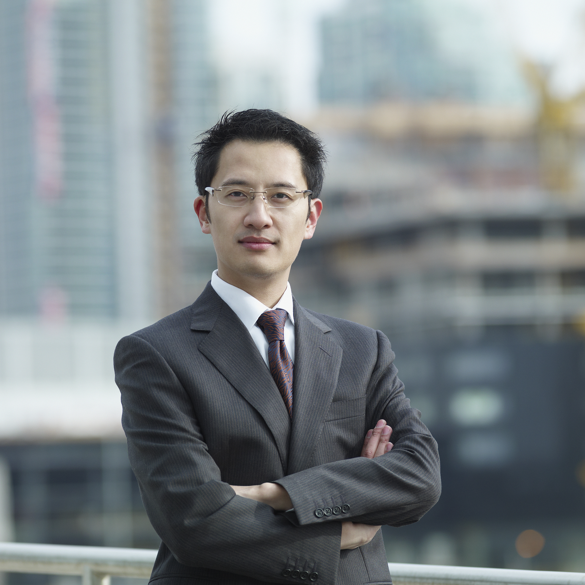 chinese businessman with arms crossed