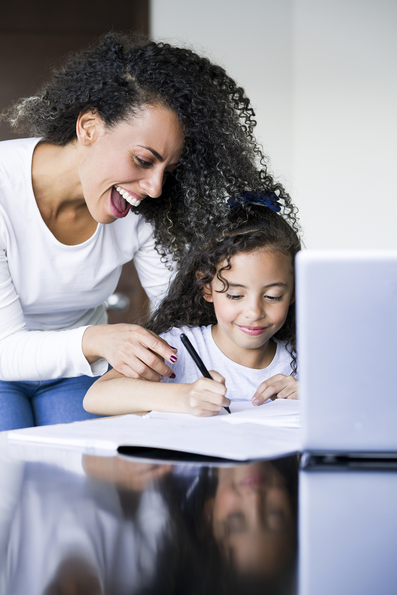 mom and daughter doing homework