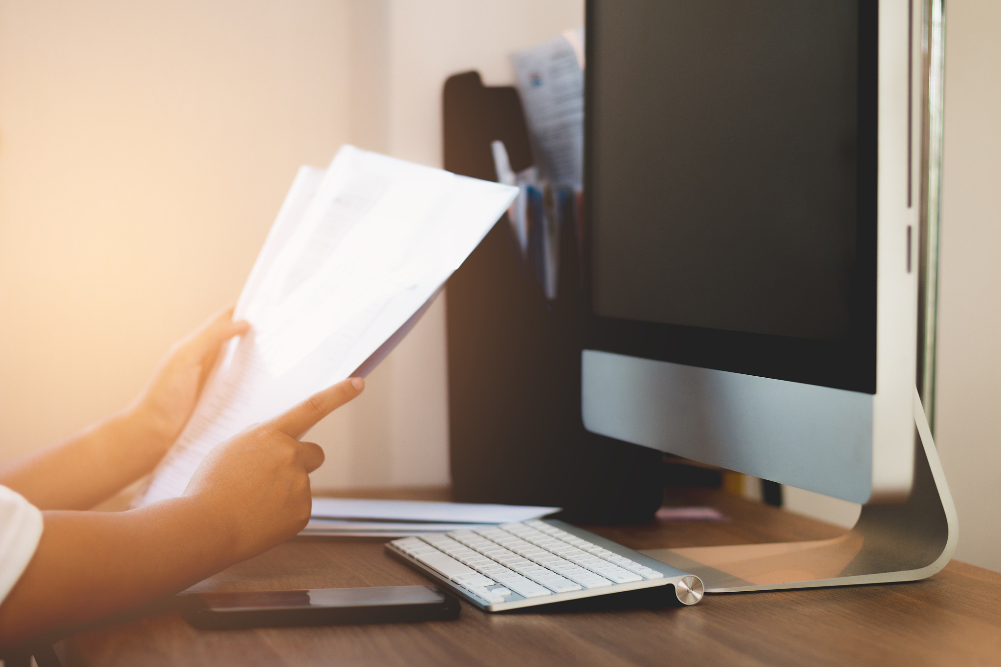 business woman reading document paper files on working table
