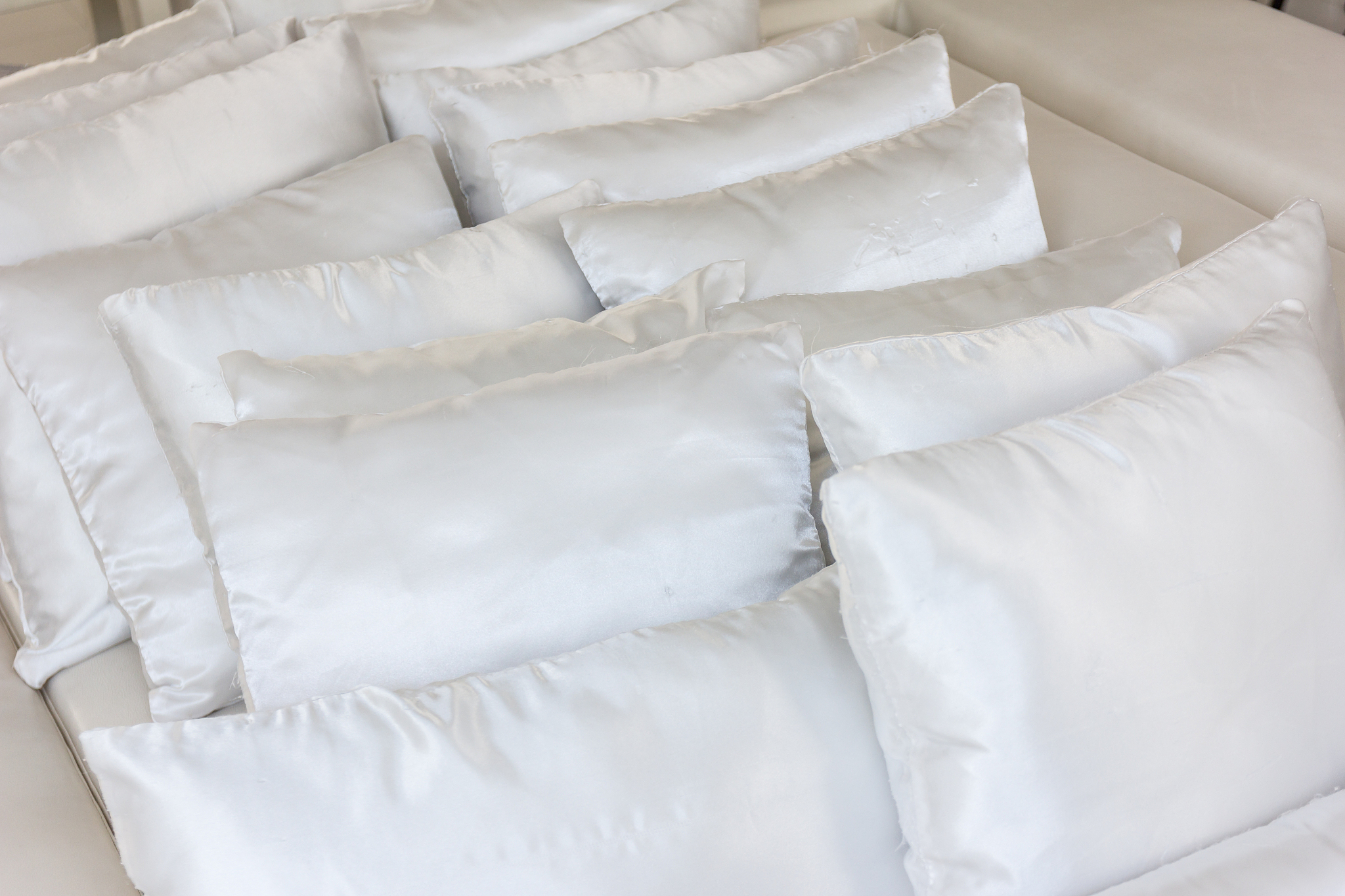 white pillows on bed close up