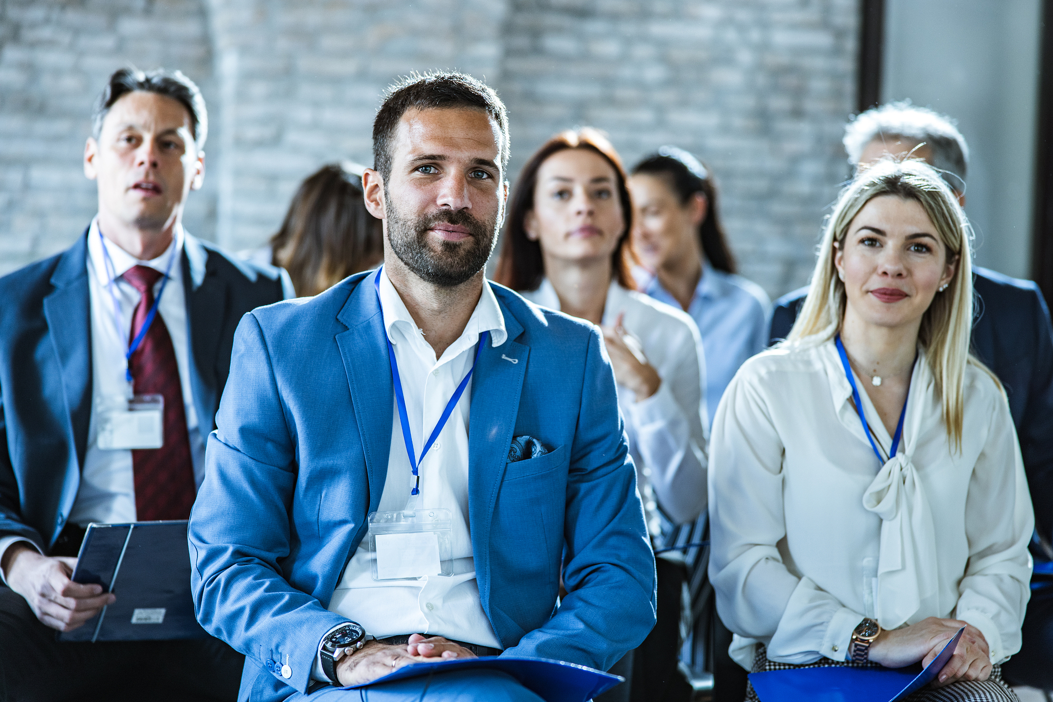 team of entrepreneurs attending a business seminar in board room