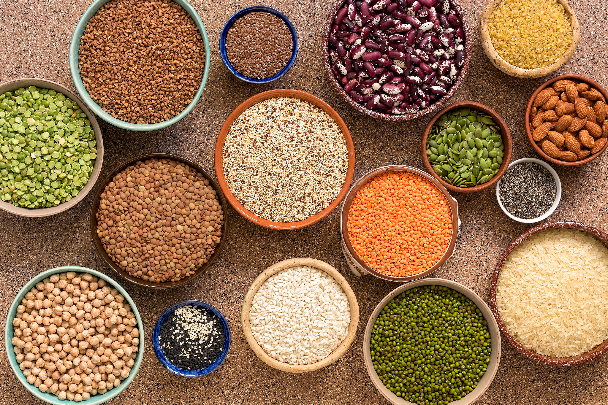 collection of various of legumes, beans, grains and seeds in bow
