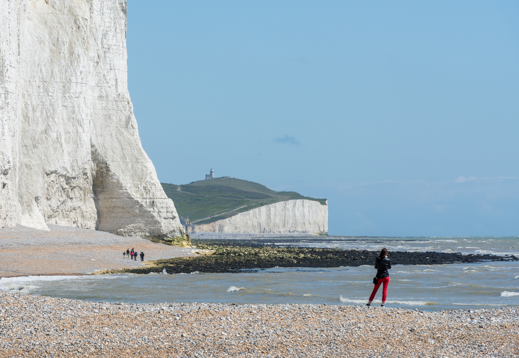 woman on the beach at the seven sisters cliffs