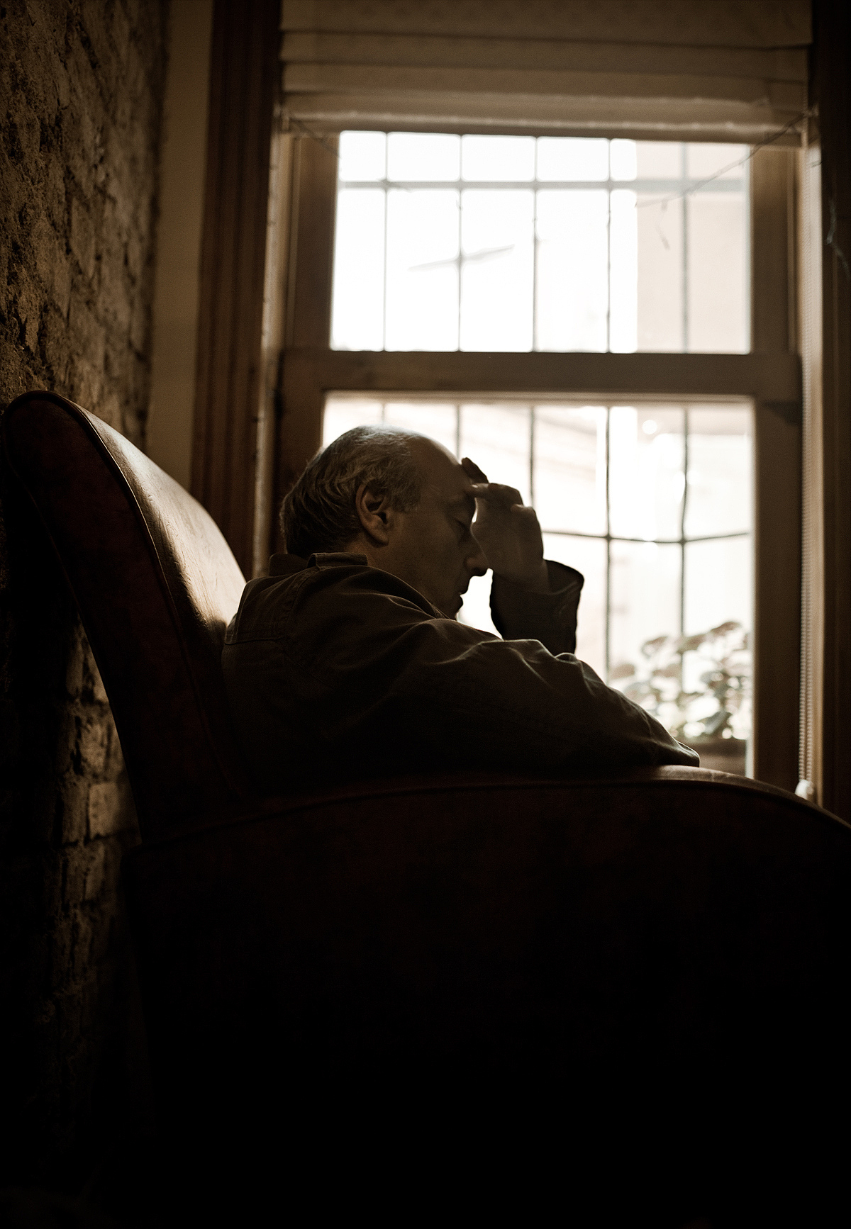 depressed senior man seating alone