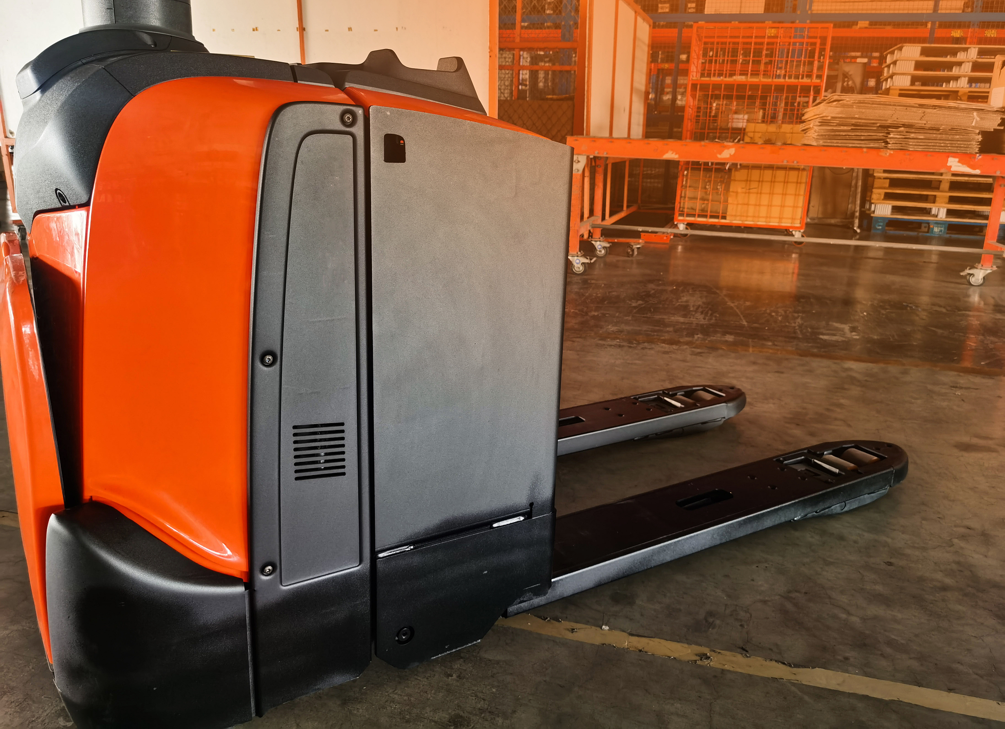 worker driving forklift loading shipment carton boxes goods on w