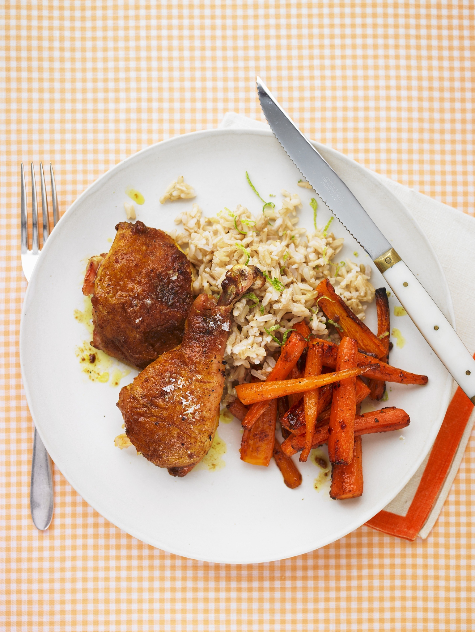 chicken legs with curry, carrots, rice and lime zest