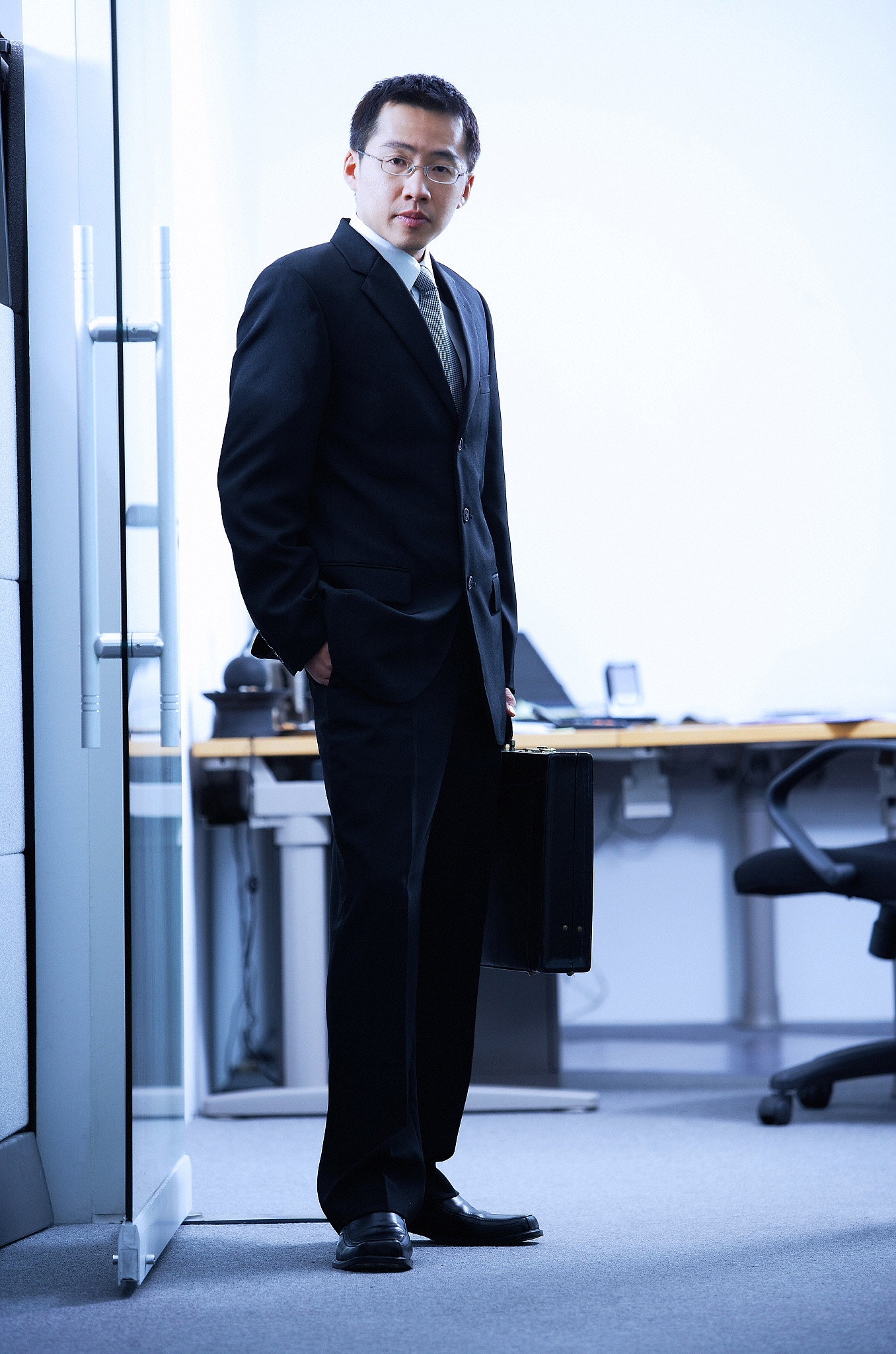 businessman standing,looking at camera,portrait