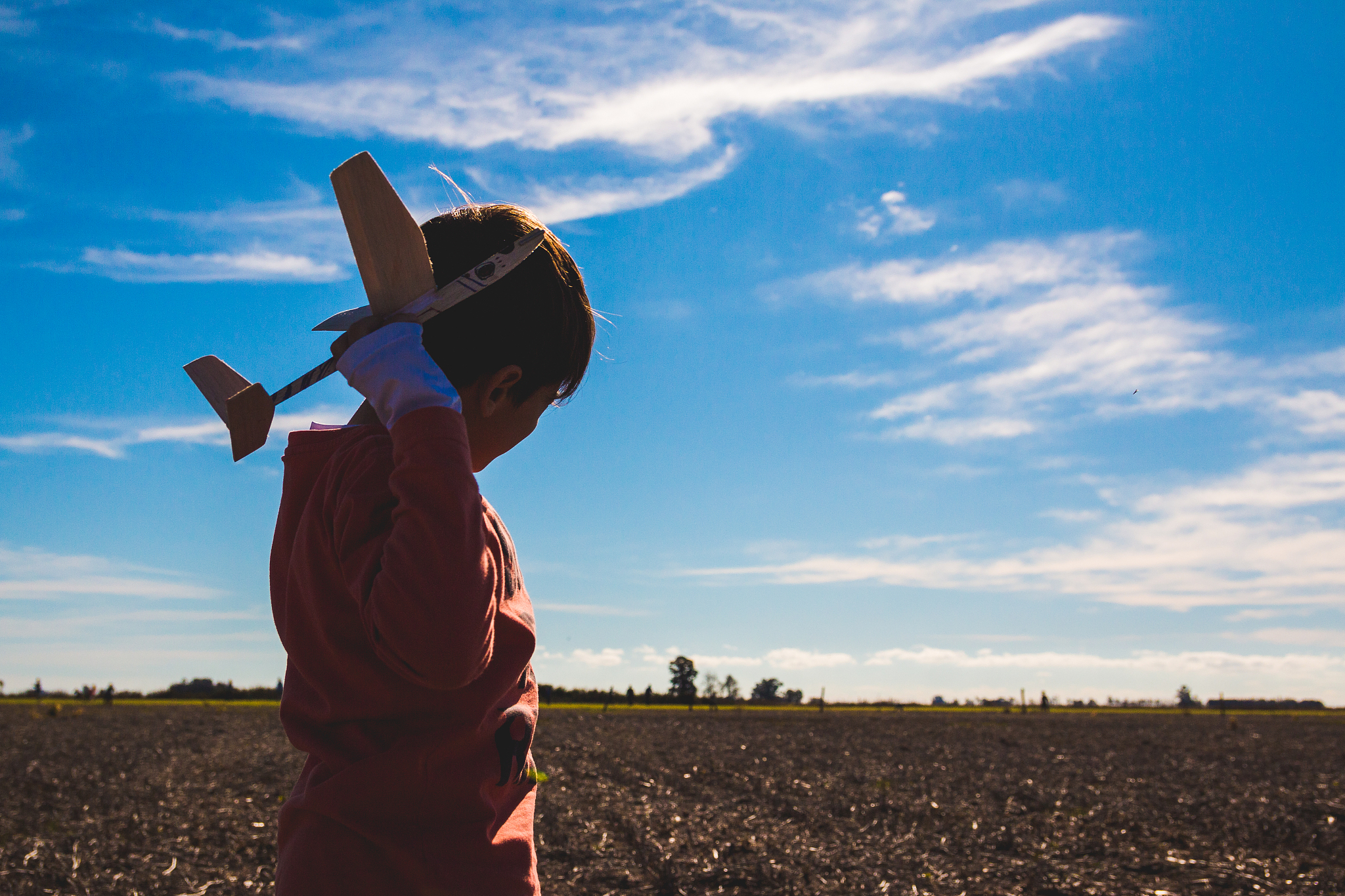 woman standing on field against sky