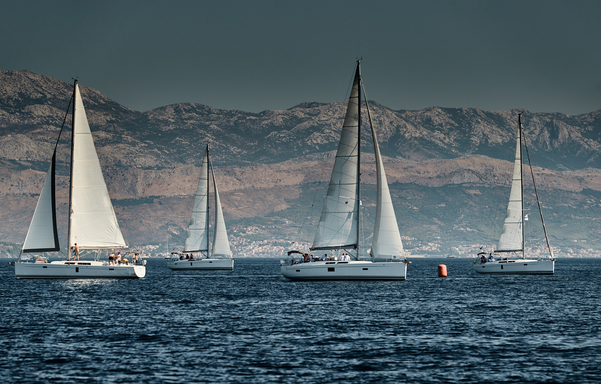 the race of sailboats, a regatta, reflection of sails on water, 