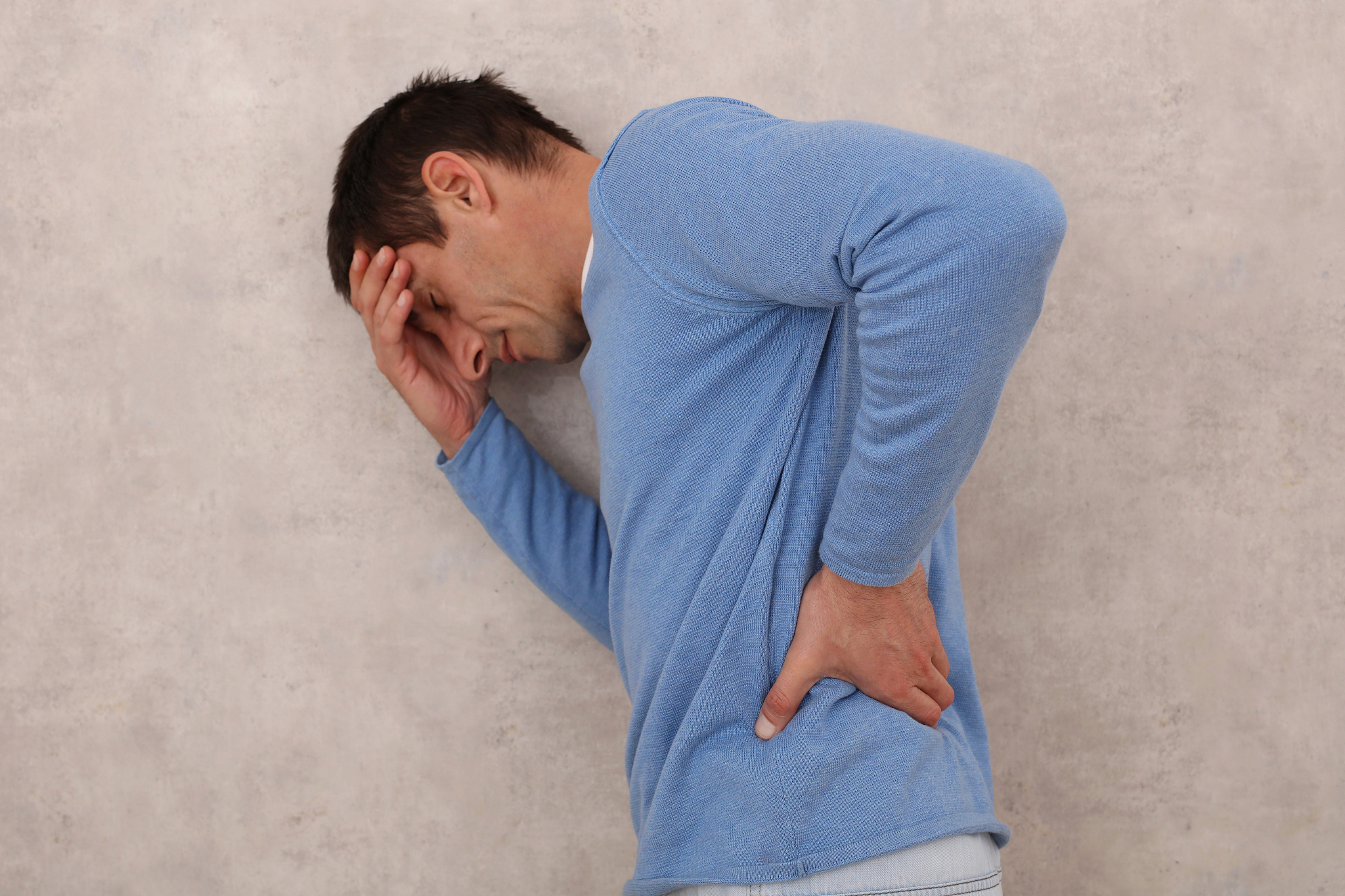 man with lower back pain, sport injury. pain relief and health c