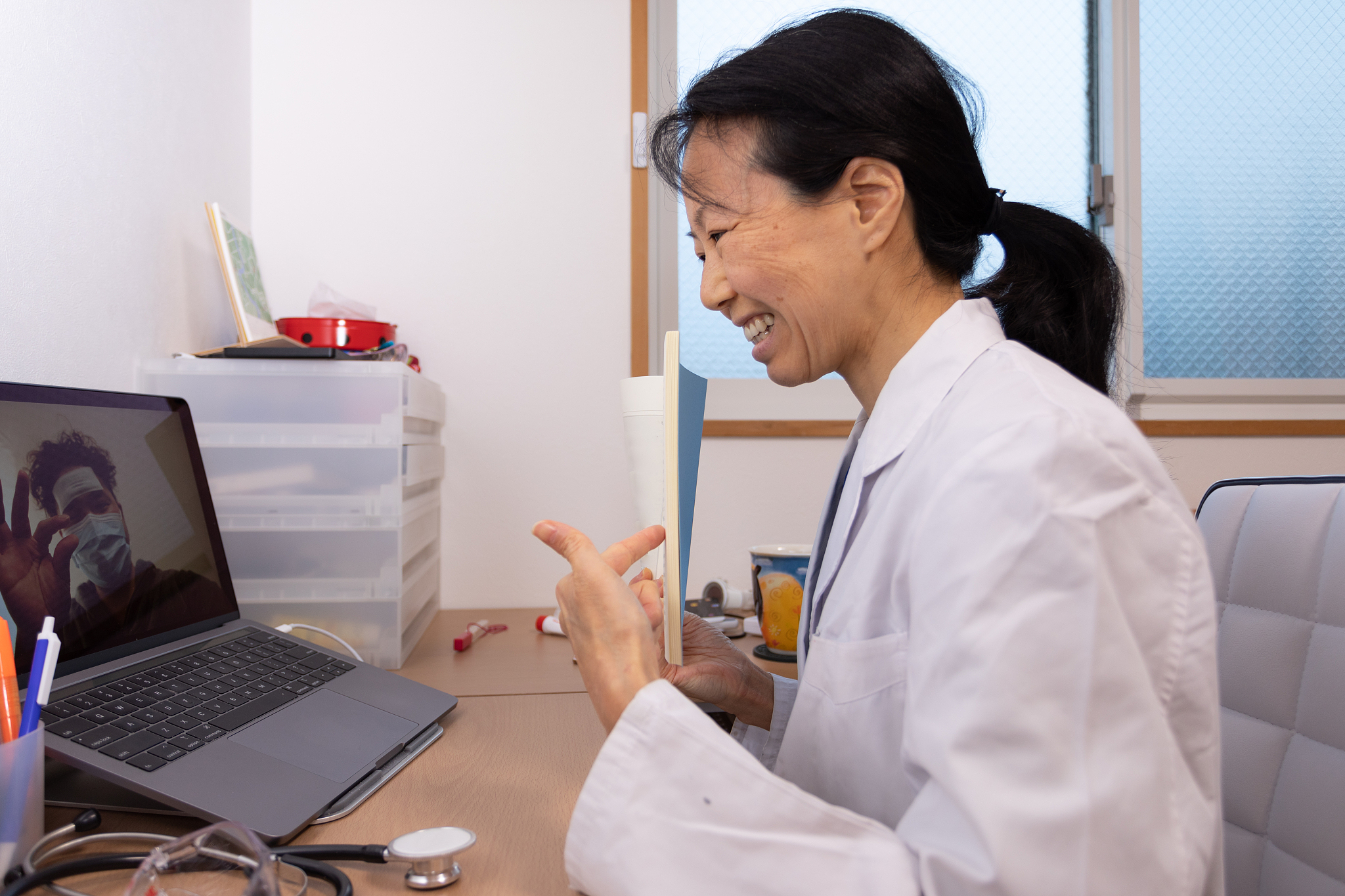 female health care worker giving online medical treatment