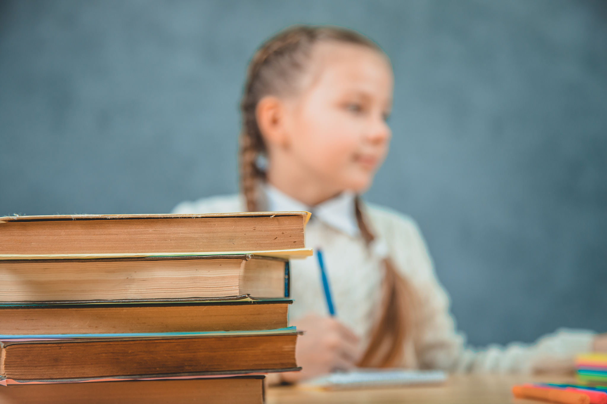 back to school. child in the class room on the blurred backgroun