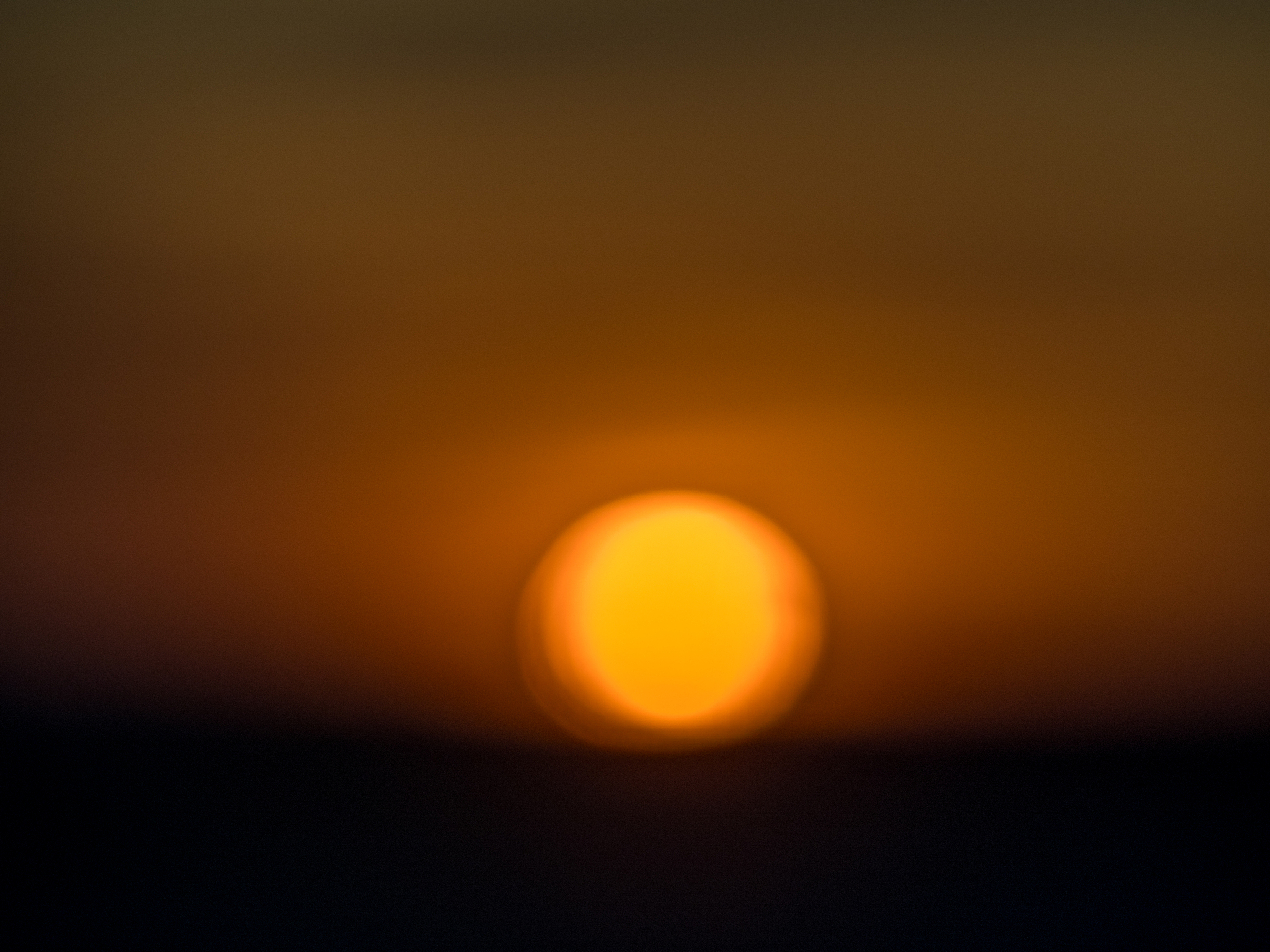 blurred photography of setting sun