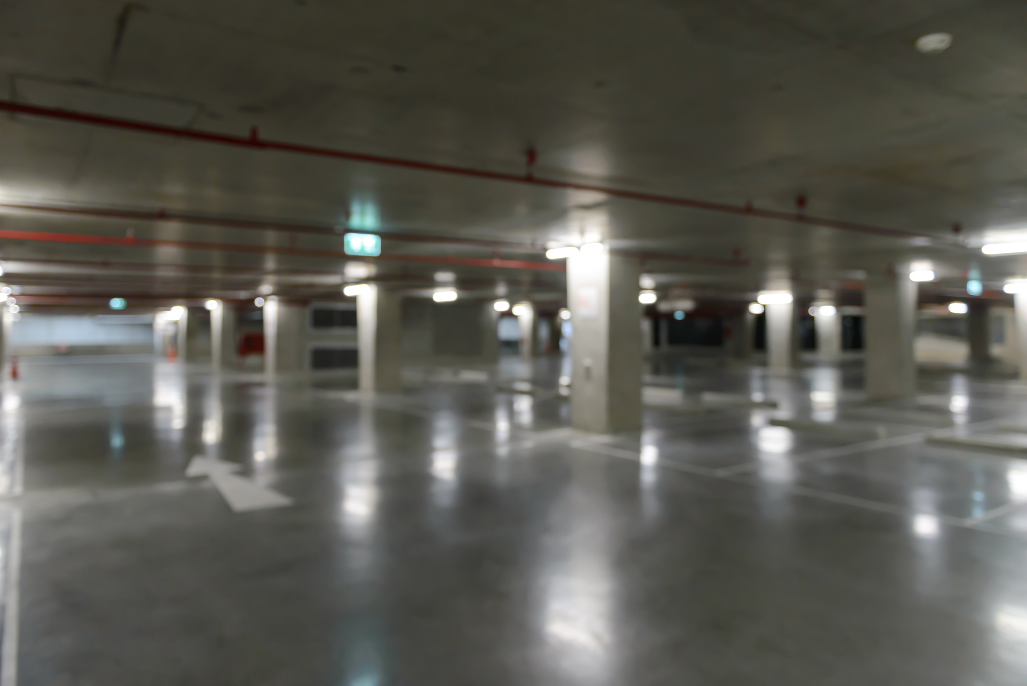 blurred image of empty underground cars parking.