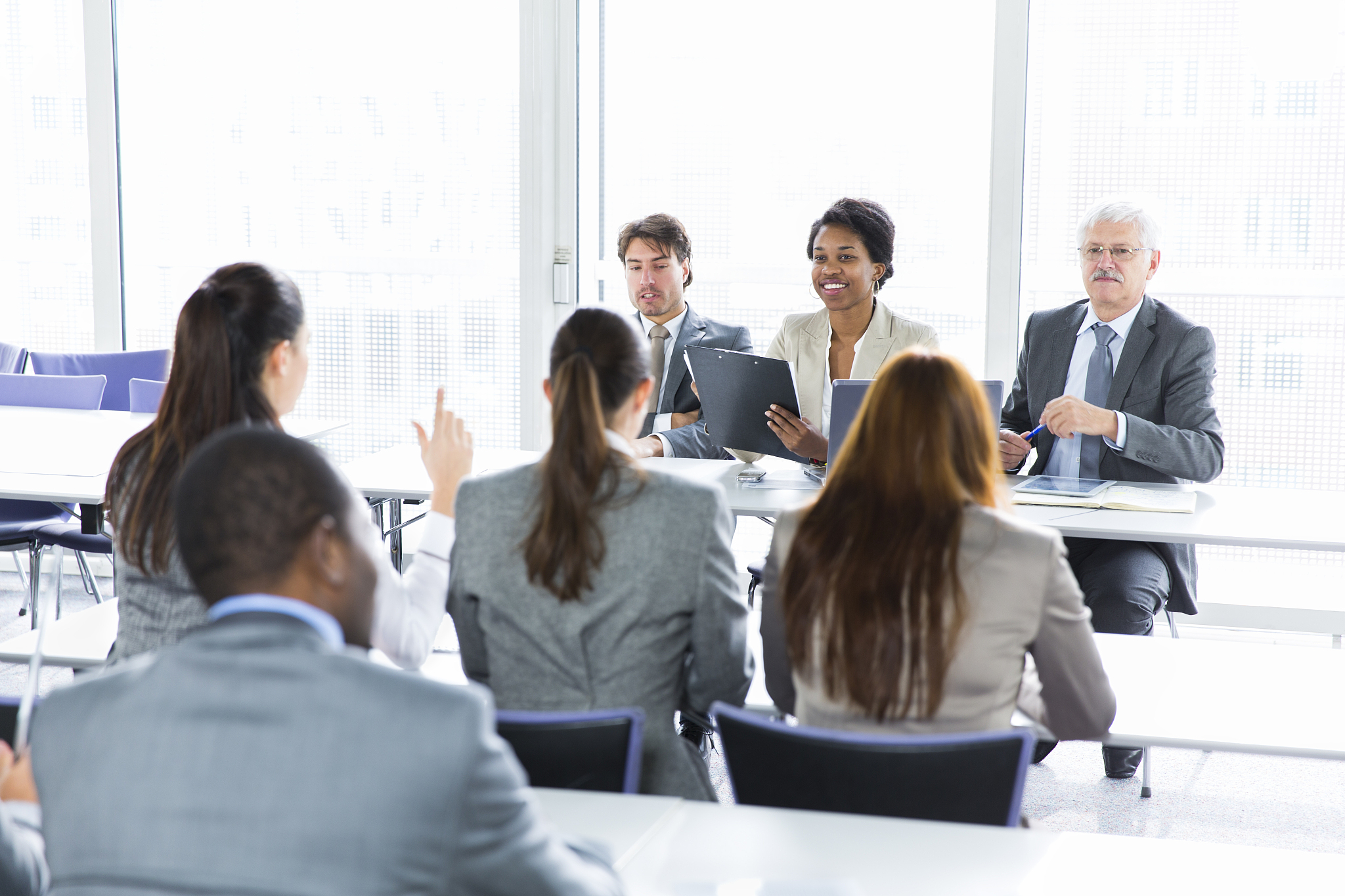 business people in education room talking about their problems