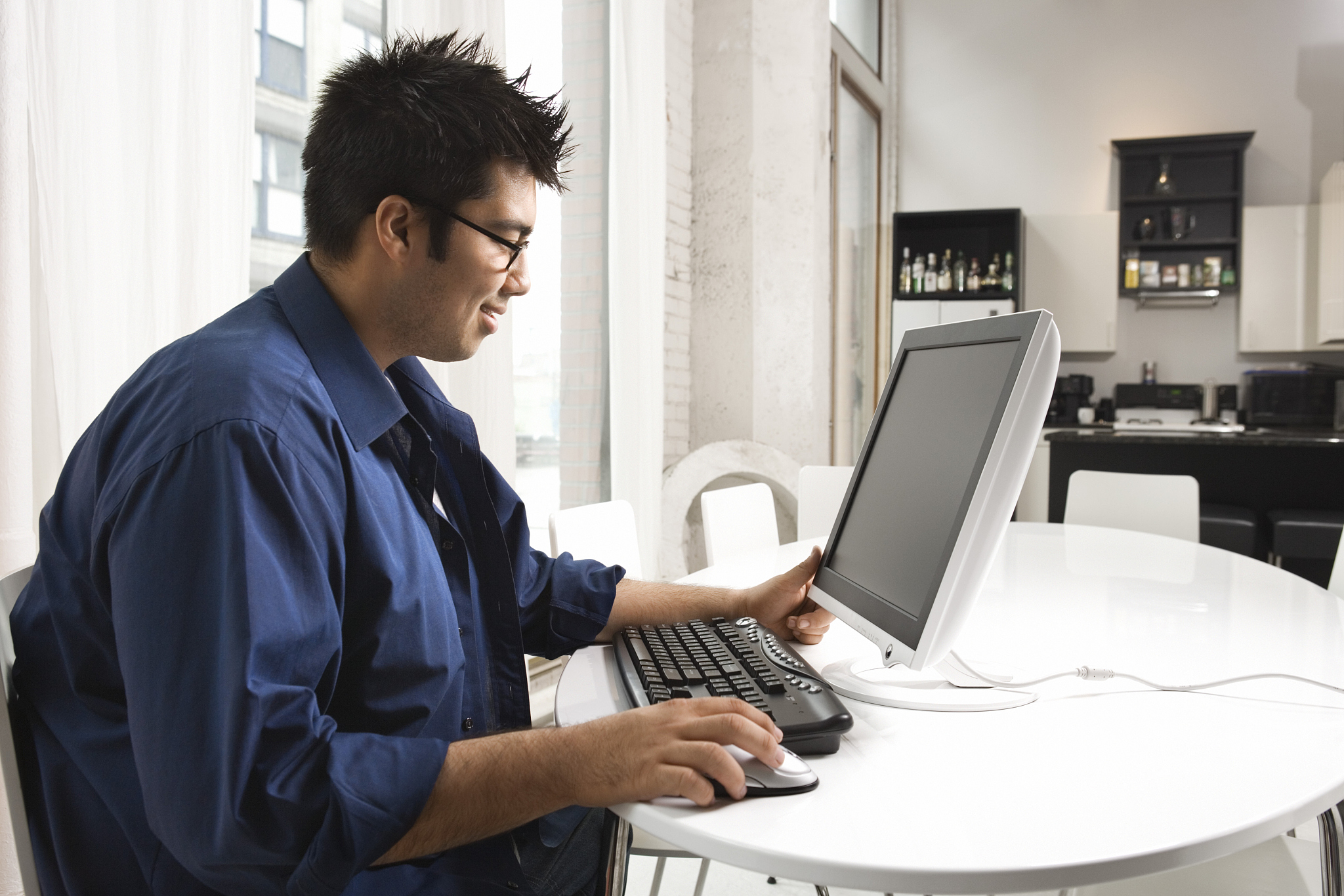 man using computer at home