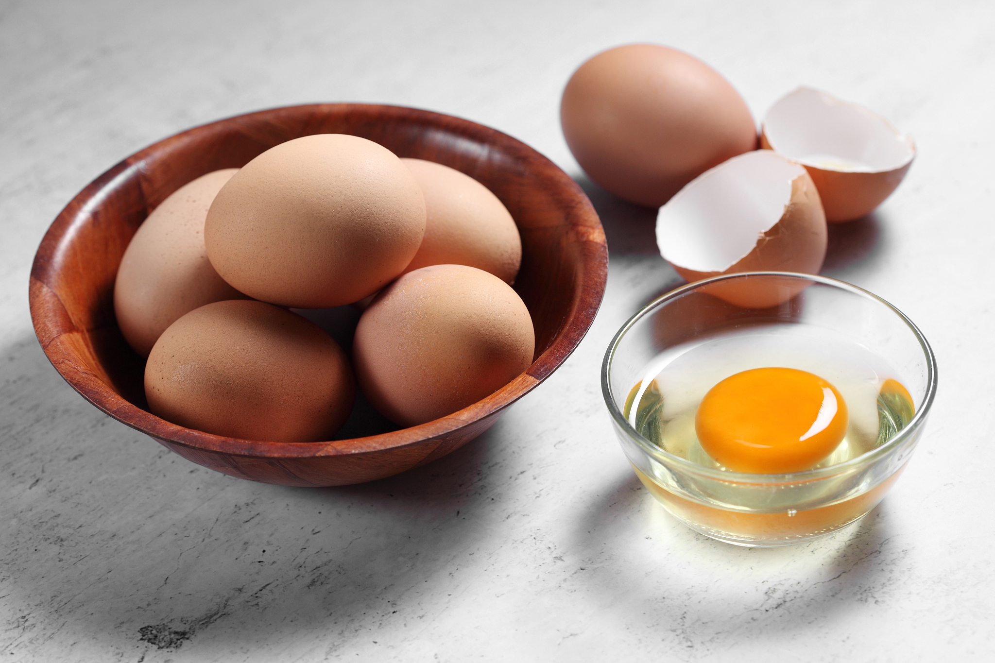 group of of raw chicken eggs on rustic background, ingredient fo