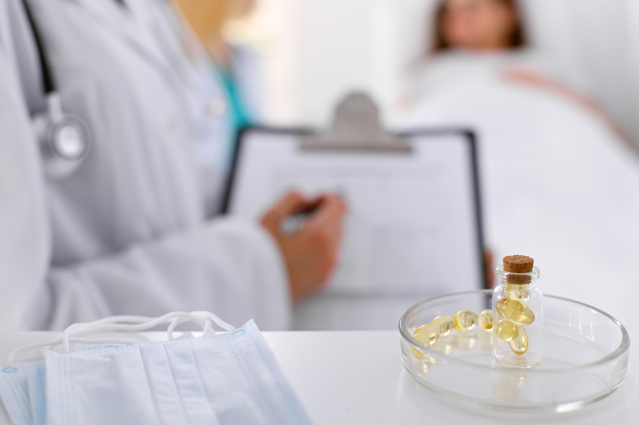 medicine capsules and pills are lying against the background of 