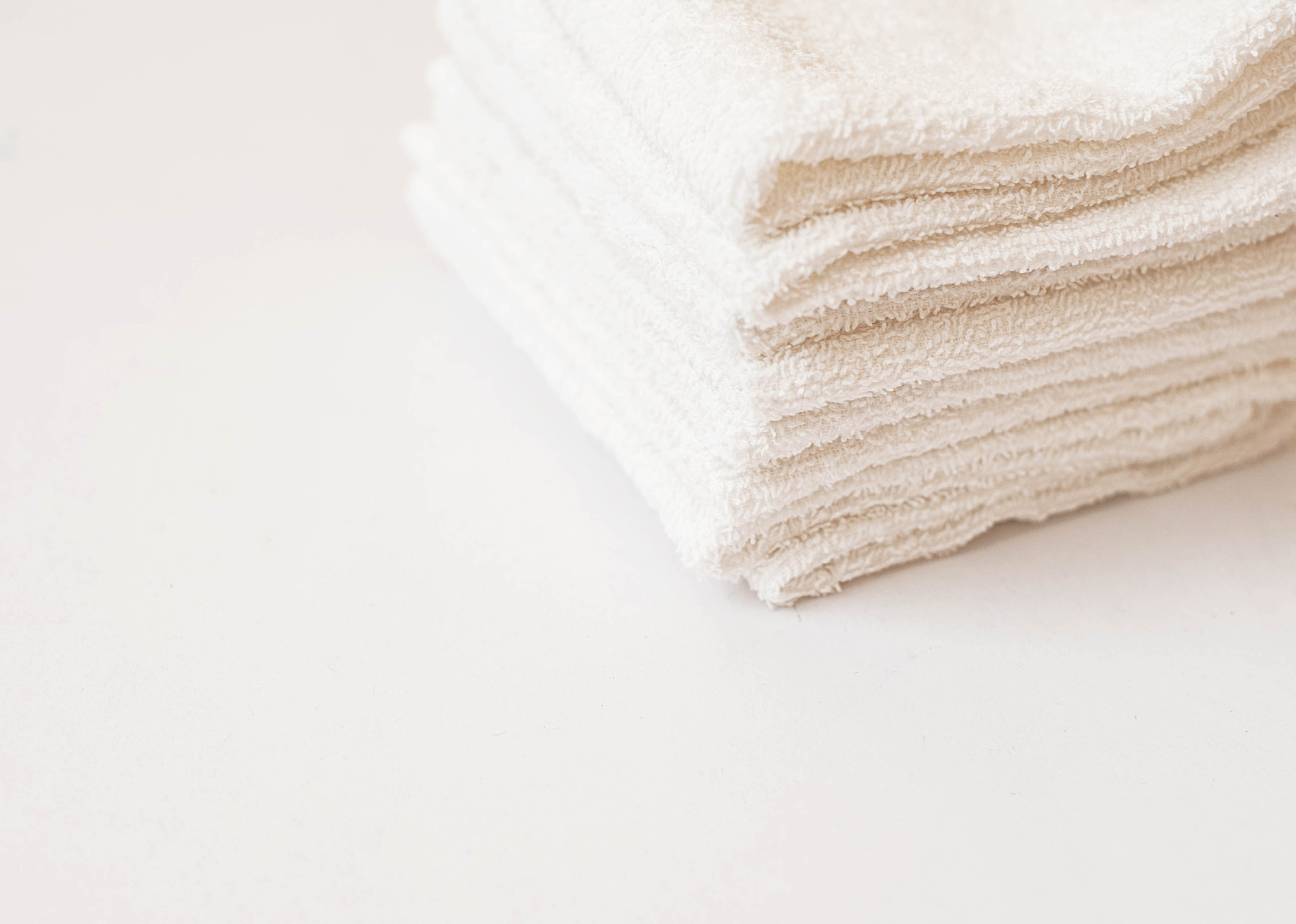 white towel on blue background . white spa towels on blue backgr